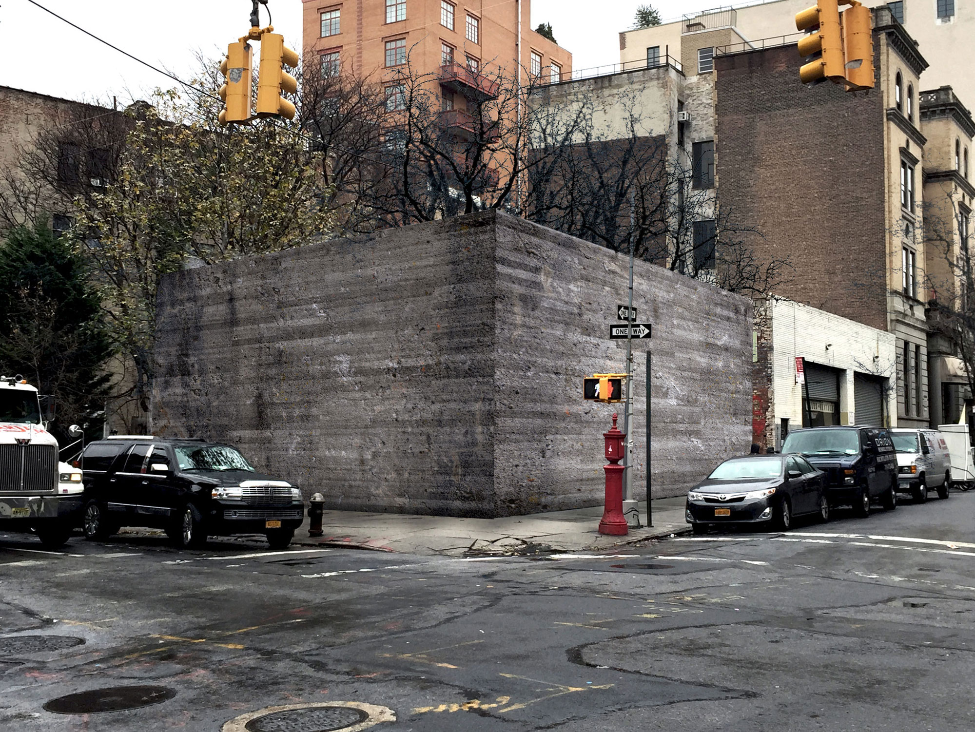 The aged, textured facade has a memory of the formwork; the trees have lost their leaves