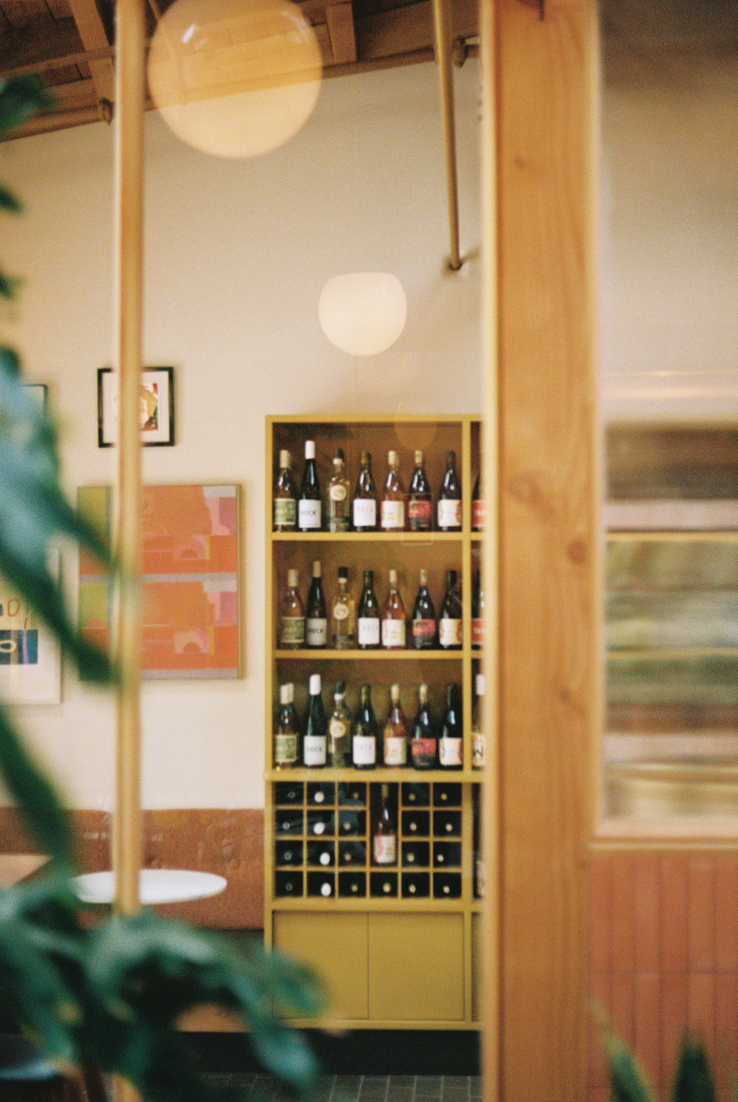 Photo of Tilda's wine shelving unit and seating area.
