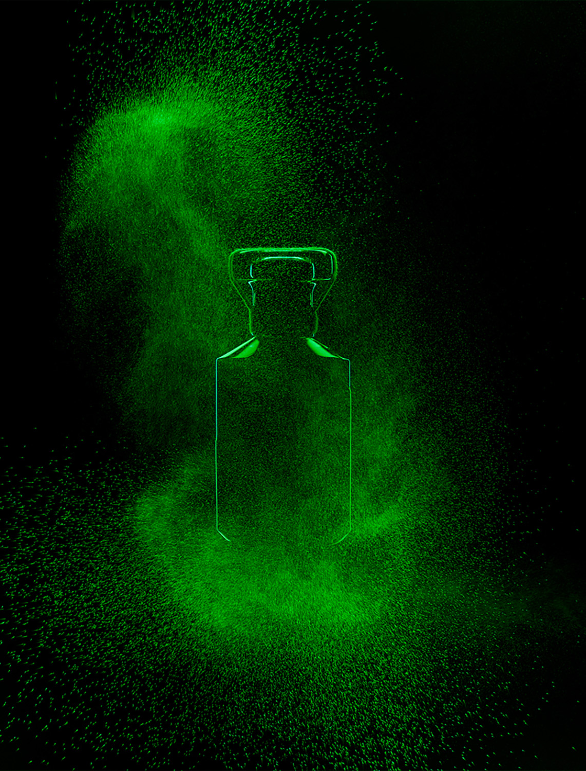 KMA photographer Isabelle Bonjean shoots a close up photograph of a perfume bottle with green smoke for Faux Q Magazine