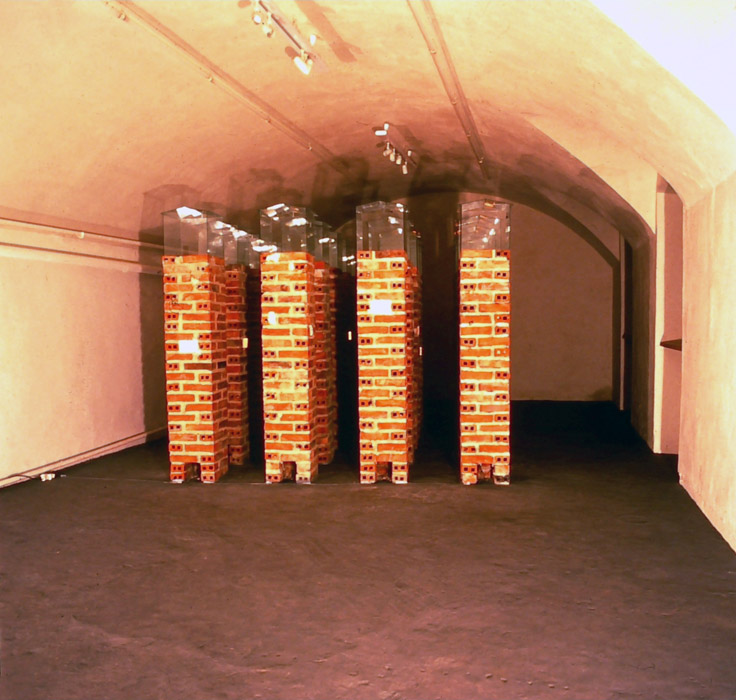 installation view, brick, glass, paper, light