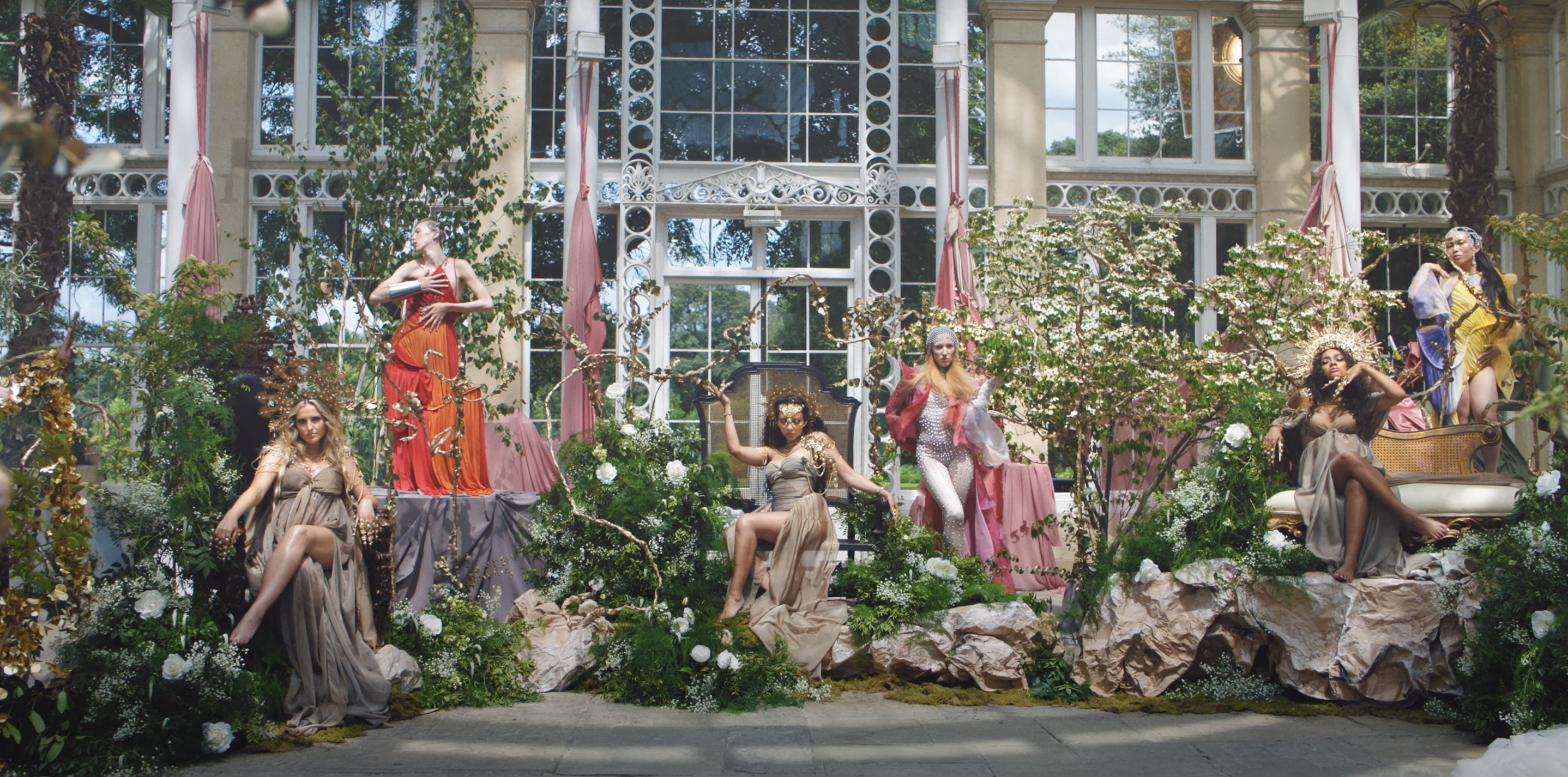 paper rocks painted in acrylic, set decorated the fabric detailing behind the dancers, and plant placement
