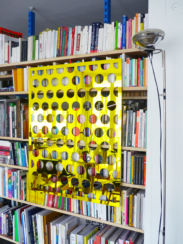 Hello Hello Rei Rei Kawakubo Kawakubo, laser cut tinted plexiglas mirror (displayed on a bookshelf), 100x80 cm, 2014.