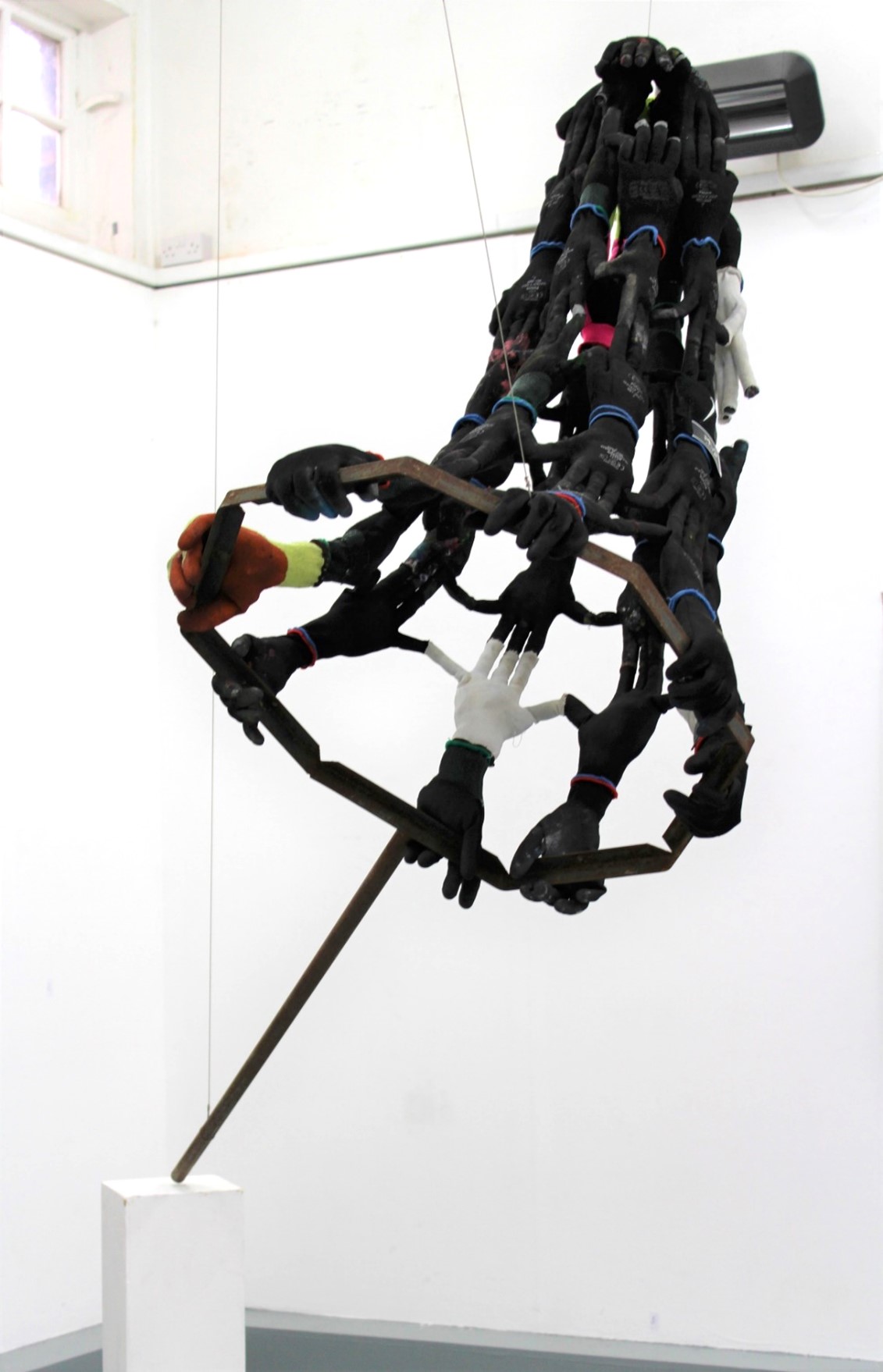 Artwork title: Never Been Caught Date: 2023. Artwork size: Dimensions variable. Medium: Steel, thread, wool, gloves, wire.