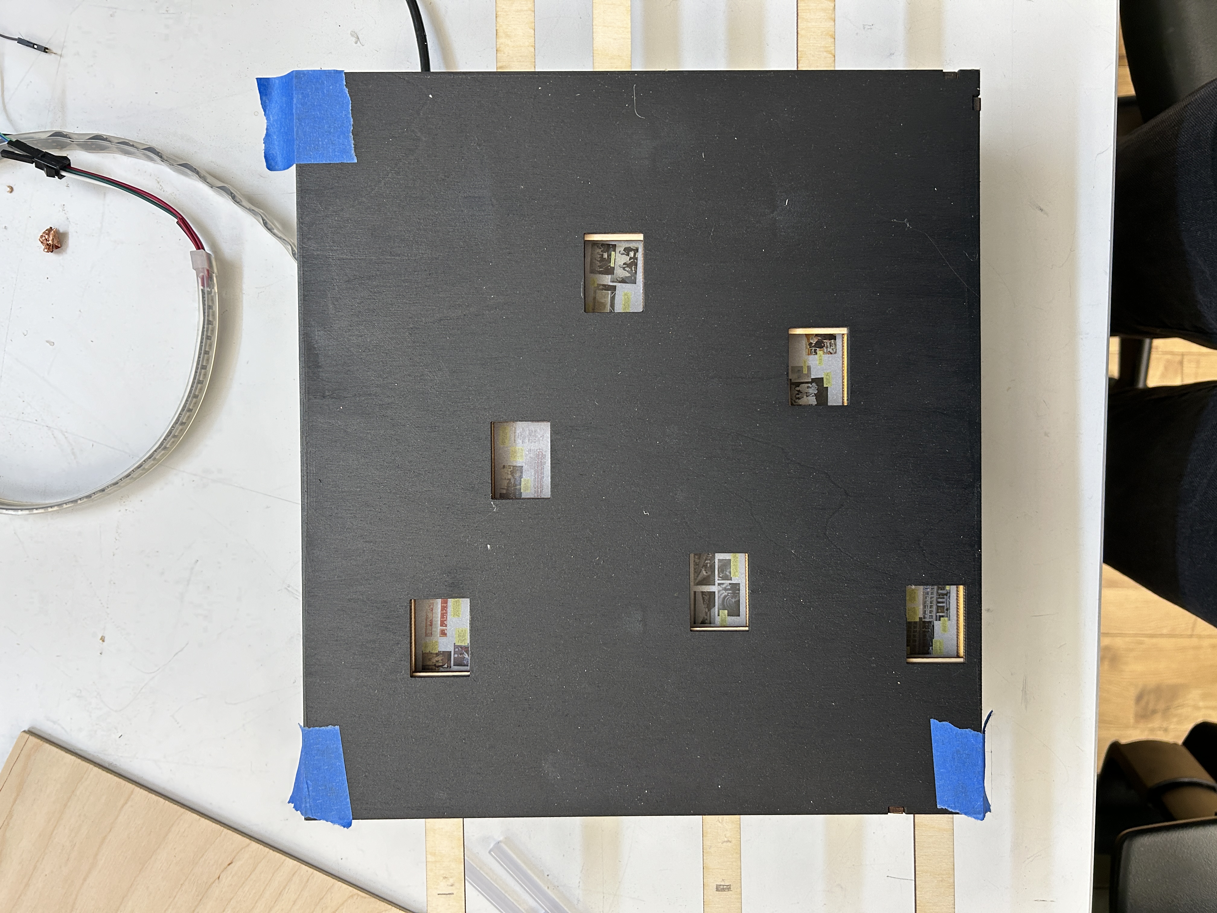 I taped the collages to the underside of the bottom layer.