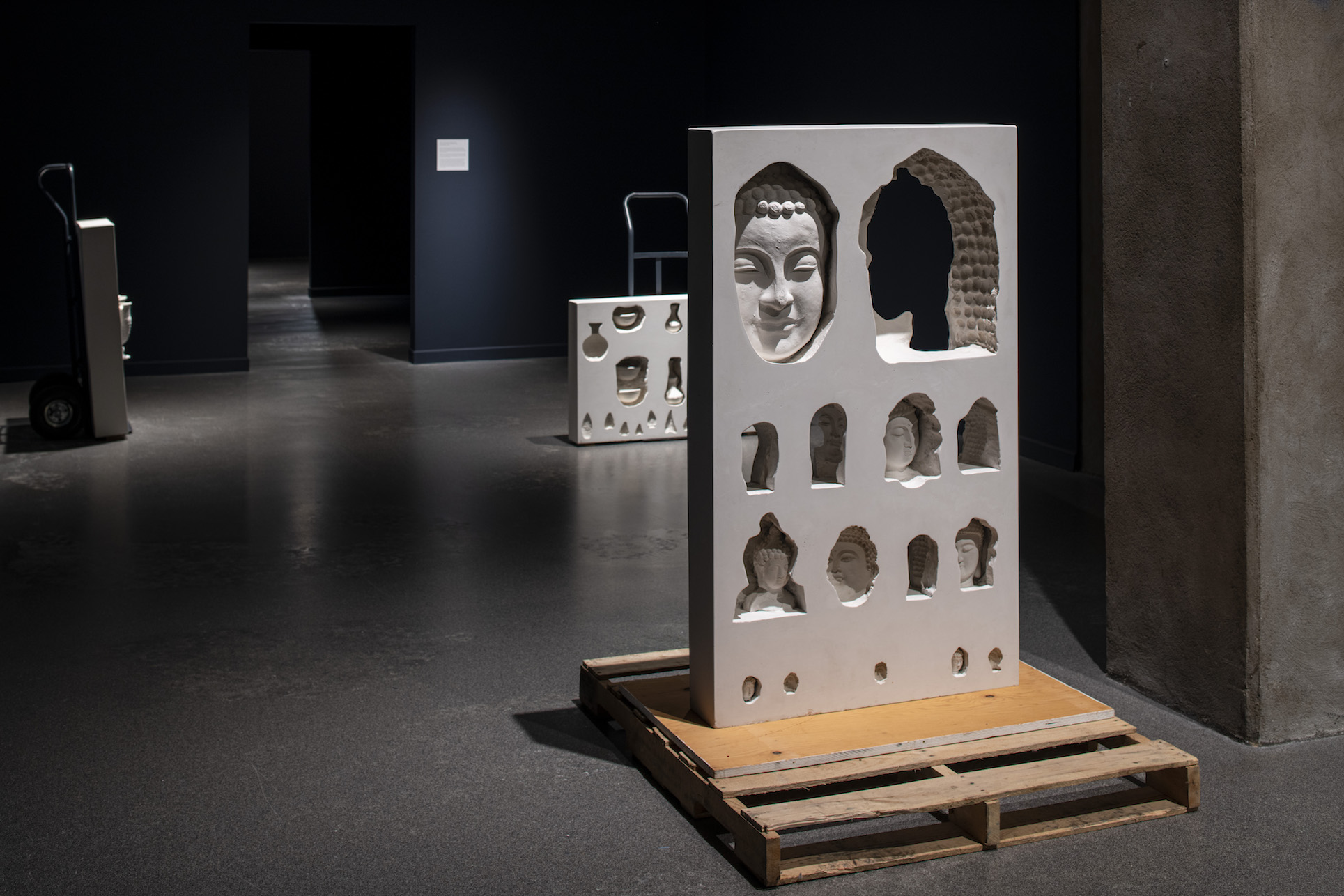 Left to right: Restitution Series (Pottery), 2021; Restitution Series (Pottery and Weapons), 2021; Restitution Series (Buddha Heads), 2021. Plaster, fibreglass, burlap, dolly, wood.