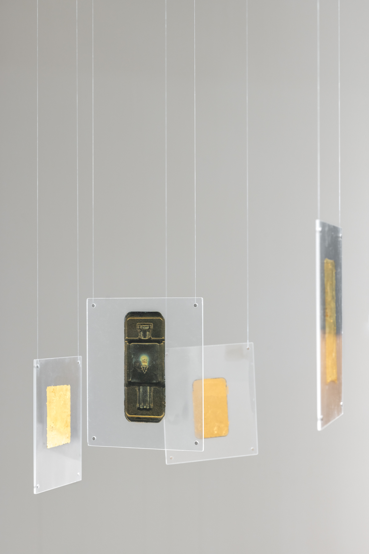 Robert Blake, "Oracle," ca. 2012. Gold leaf on acetate encased in plexiglass, 9 1/2 x 8 1/2 inches each. Photo by Rafael Gamo.