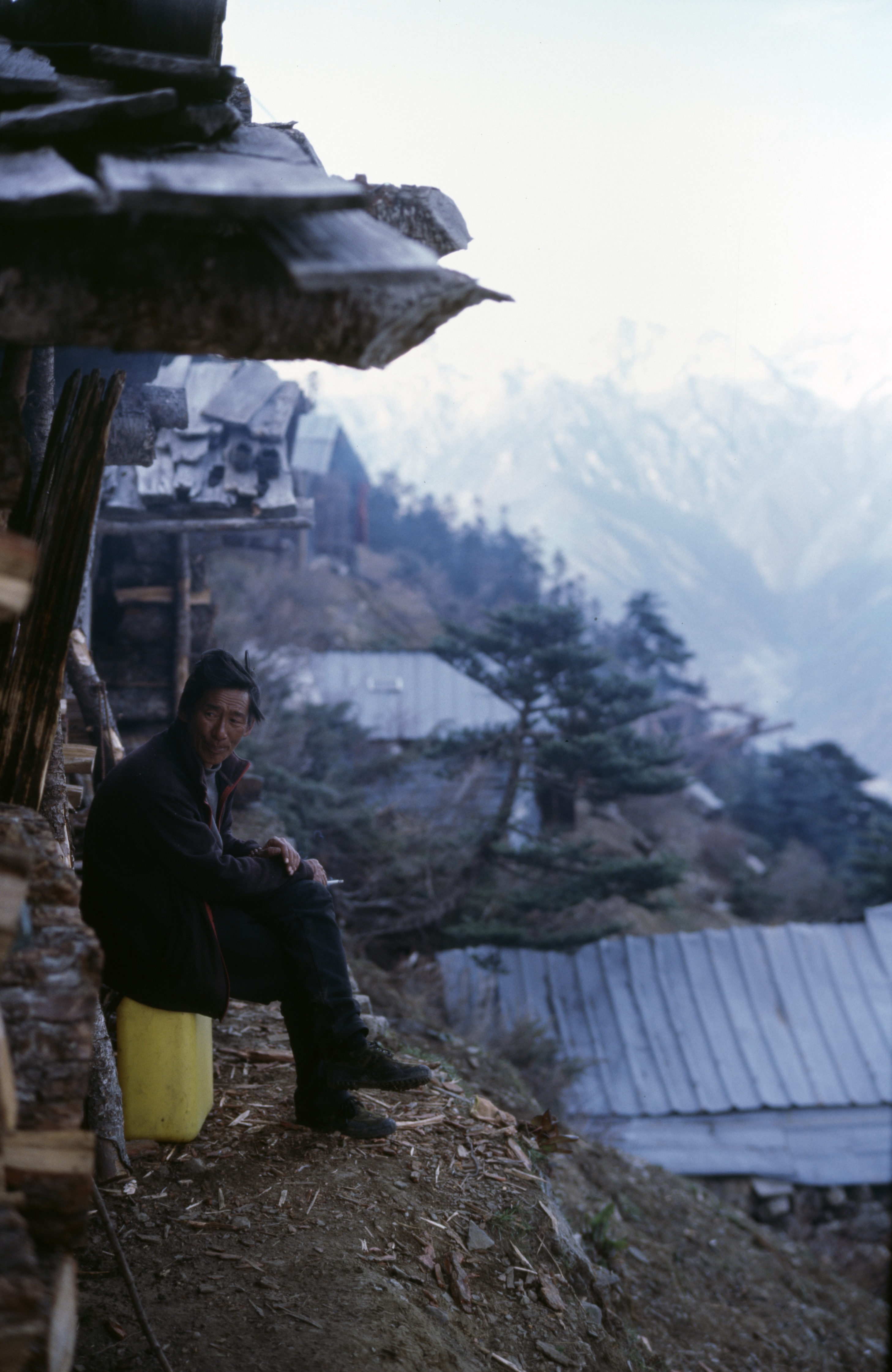 Tibetan man, outside village home