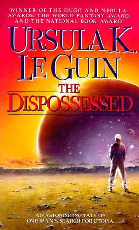 A human with white hair stands with their head bowed wearing a purple jumpsuit and facing away from the purple planet behind them. The sky shifts from pink to yellow behind the title “the dispossessed” by Ursula K LeGuin.