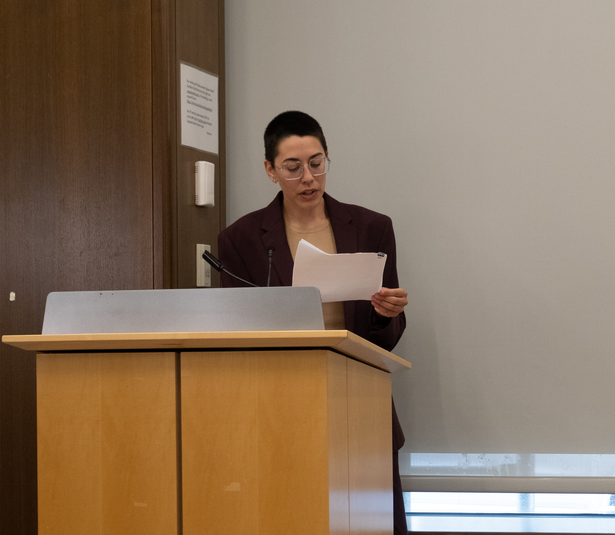 Jhani Randhawa introduces panelists and reads Anthony Vani Capildeo's poem in their absence. New York University, NYC 2022.