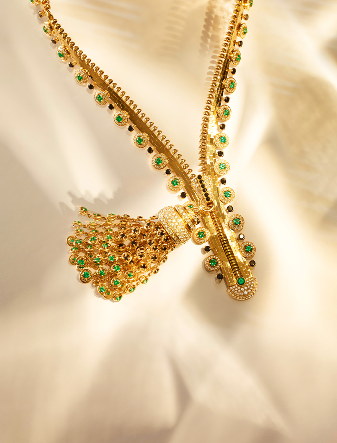 KMA photographer Isabelle Bonjean shoots photograph of gold necklace against gold background for Citizen K