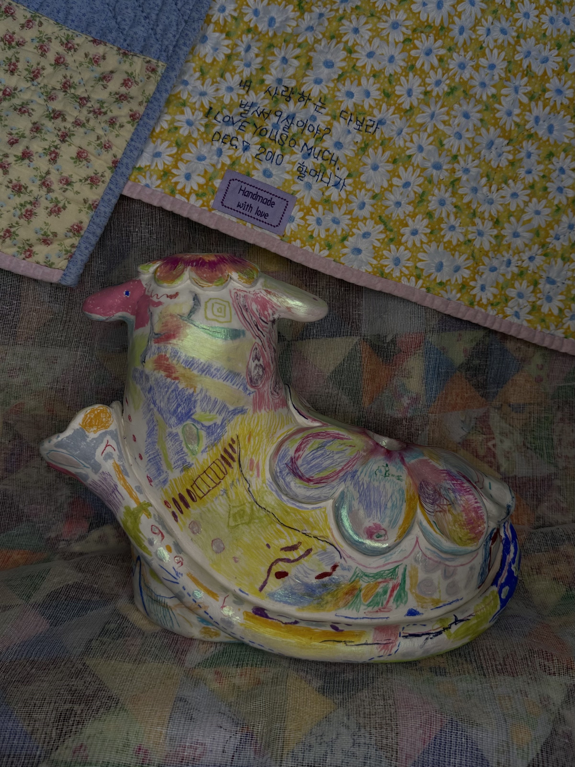 Ninth Birthday (10"x5"x8"), crayon, gel medium, and mica powder on clay