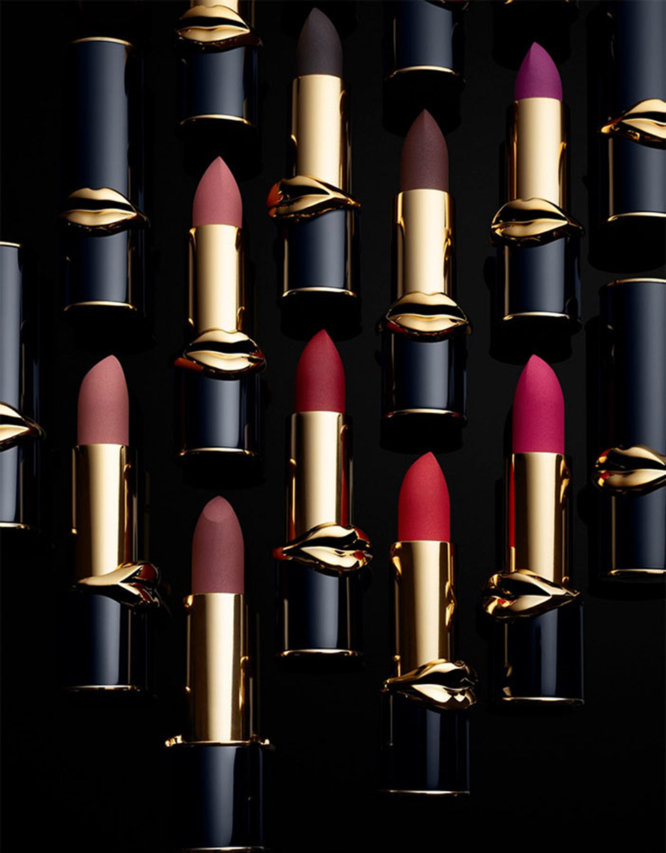 KMA stylist Rachel Haas designs set for photo of many colorful lipsticks with black tubes for Pat McGrath