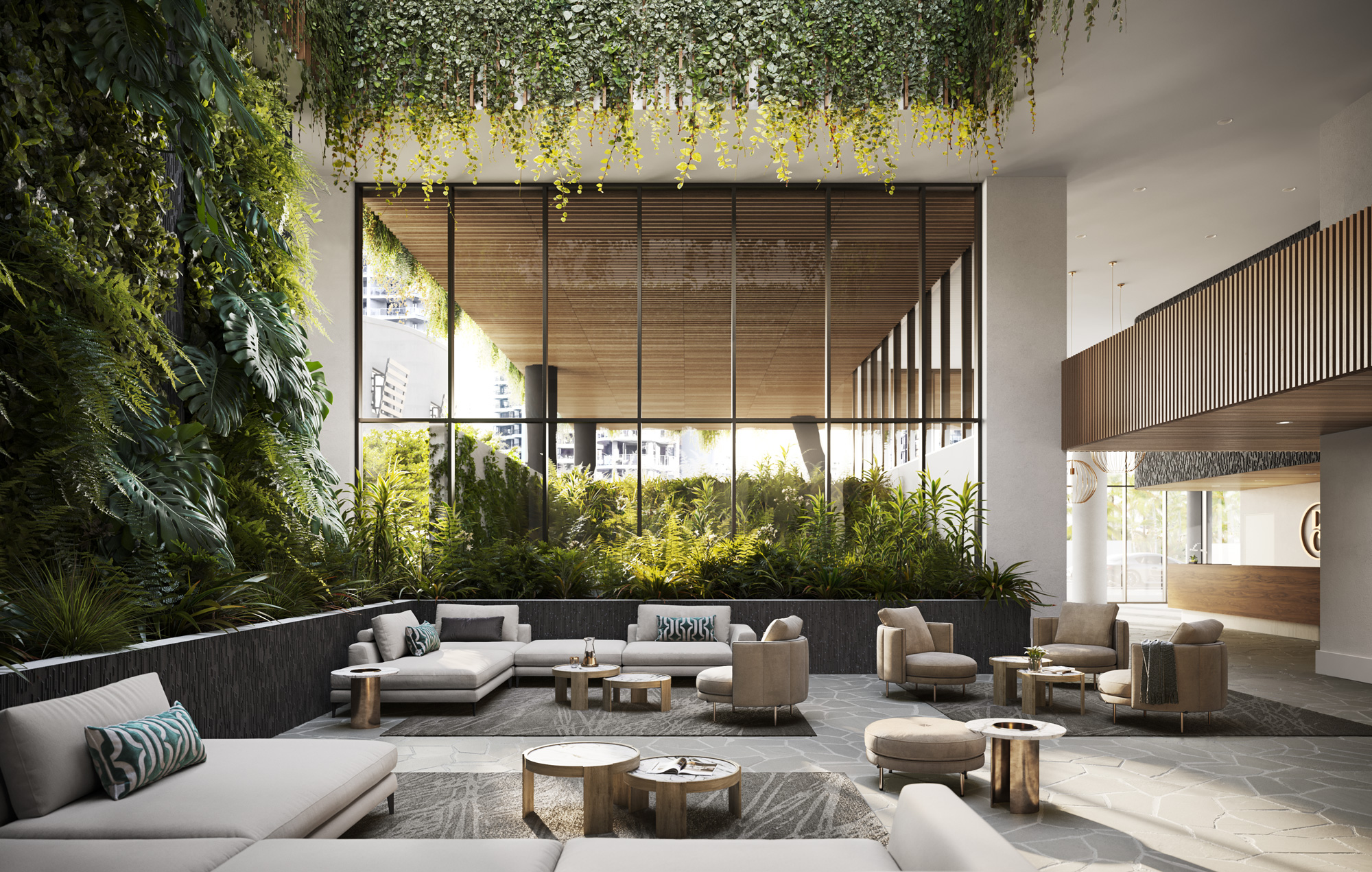 The grand lobby experience of Belvedere Main Beach, featuring large glass pane windows and cascading sub-tropical landscape.