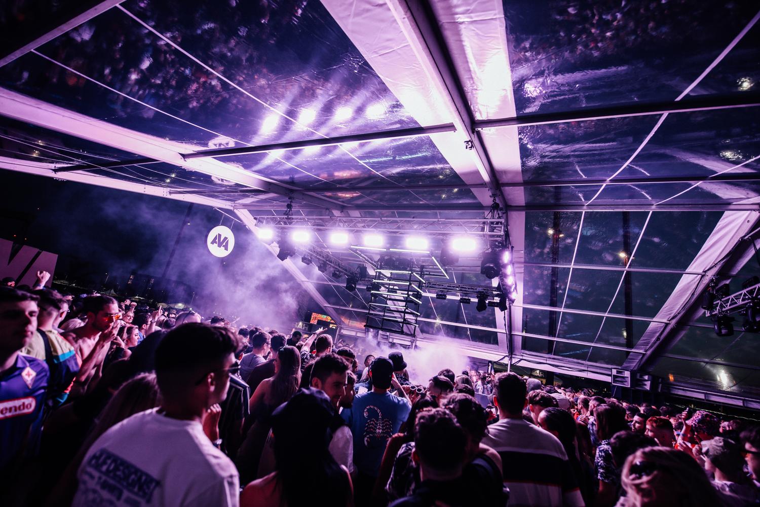 Packed Boiler Room stage at AVA Festival Belfast with purple lighting and crowd energy