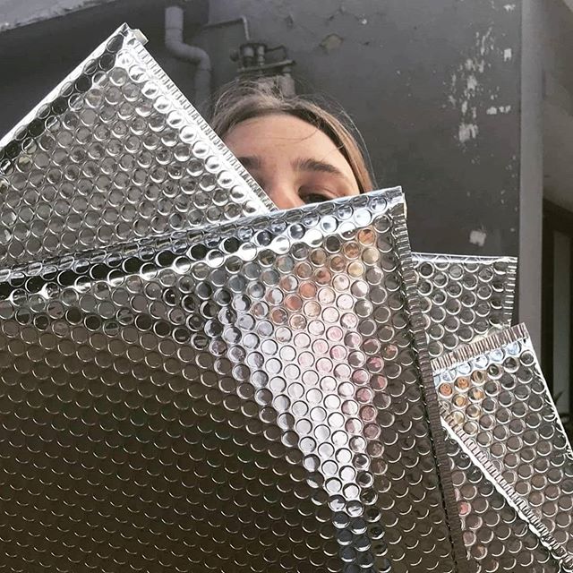 Headshot of Bernie with packaging bags. 