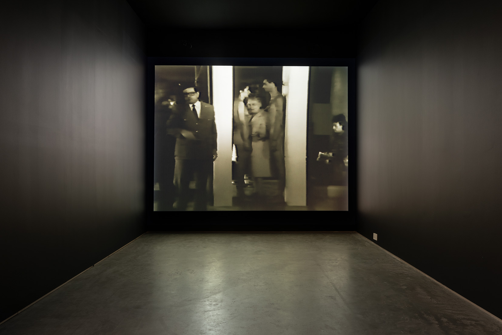 Installation view of Marina Abramović & Ulay's "Imponderabilia", 1977, Single channel video projection, black and white, loop, sound. Image by Etienne Frossard.