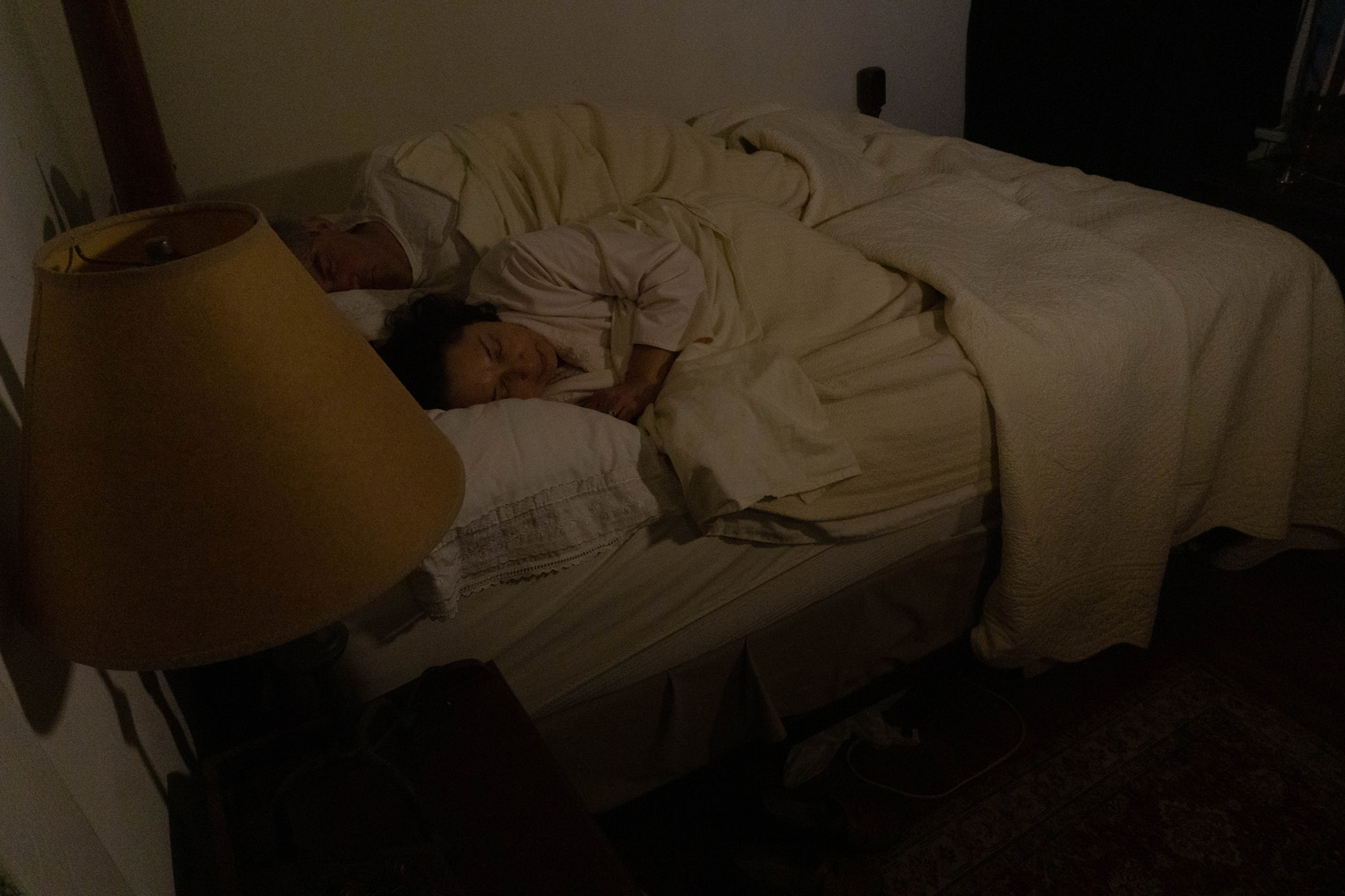 Image 3: Luisa and Placido are sleeping in bed as the spirit watches over them. Luisa was suddenly awakened by the presence of the spirit.