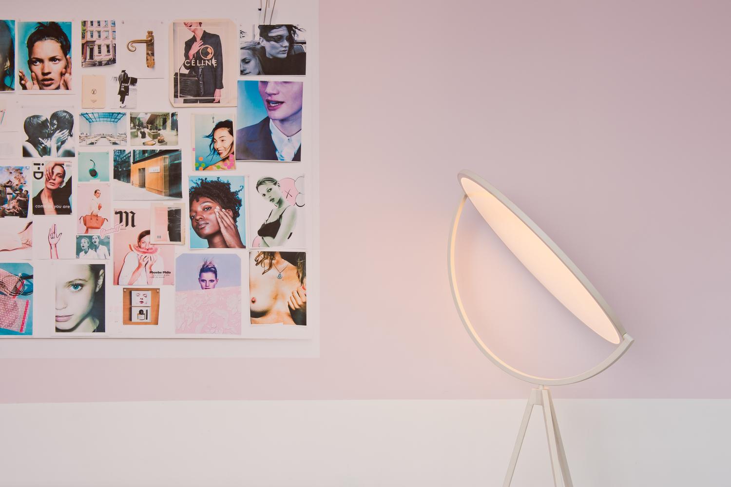 Close-up of Glossier pop-up moodboard wall featuring beauty photography and creative collage.