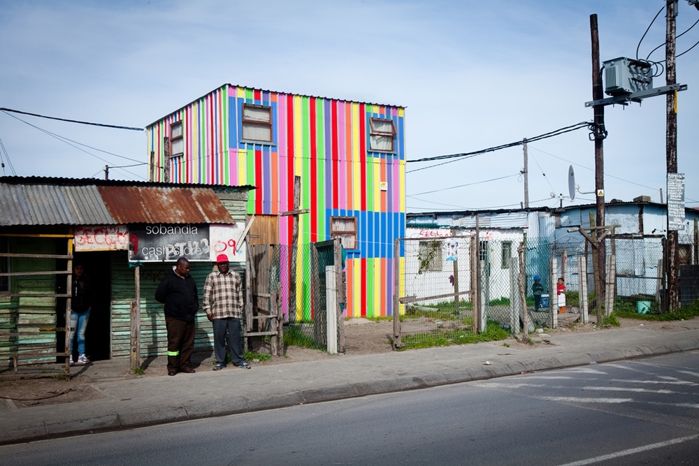 After painting the Phumezo's house, the first Empower Shack prototype