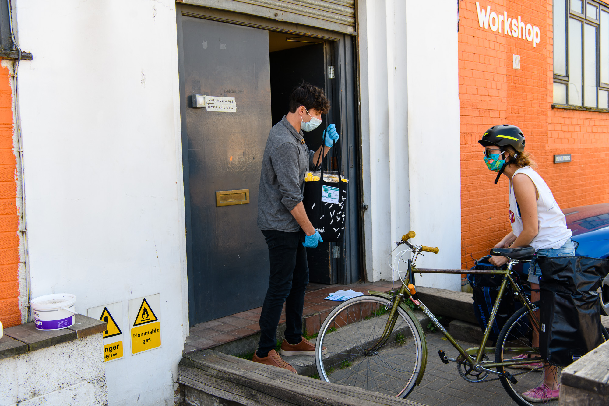 Maisie, a volunteer picking up shields to deliver to key-workers. Normally she works as a conference interpreter
