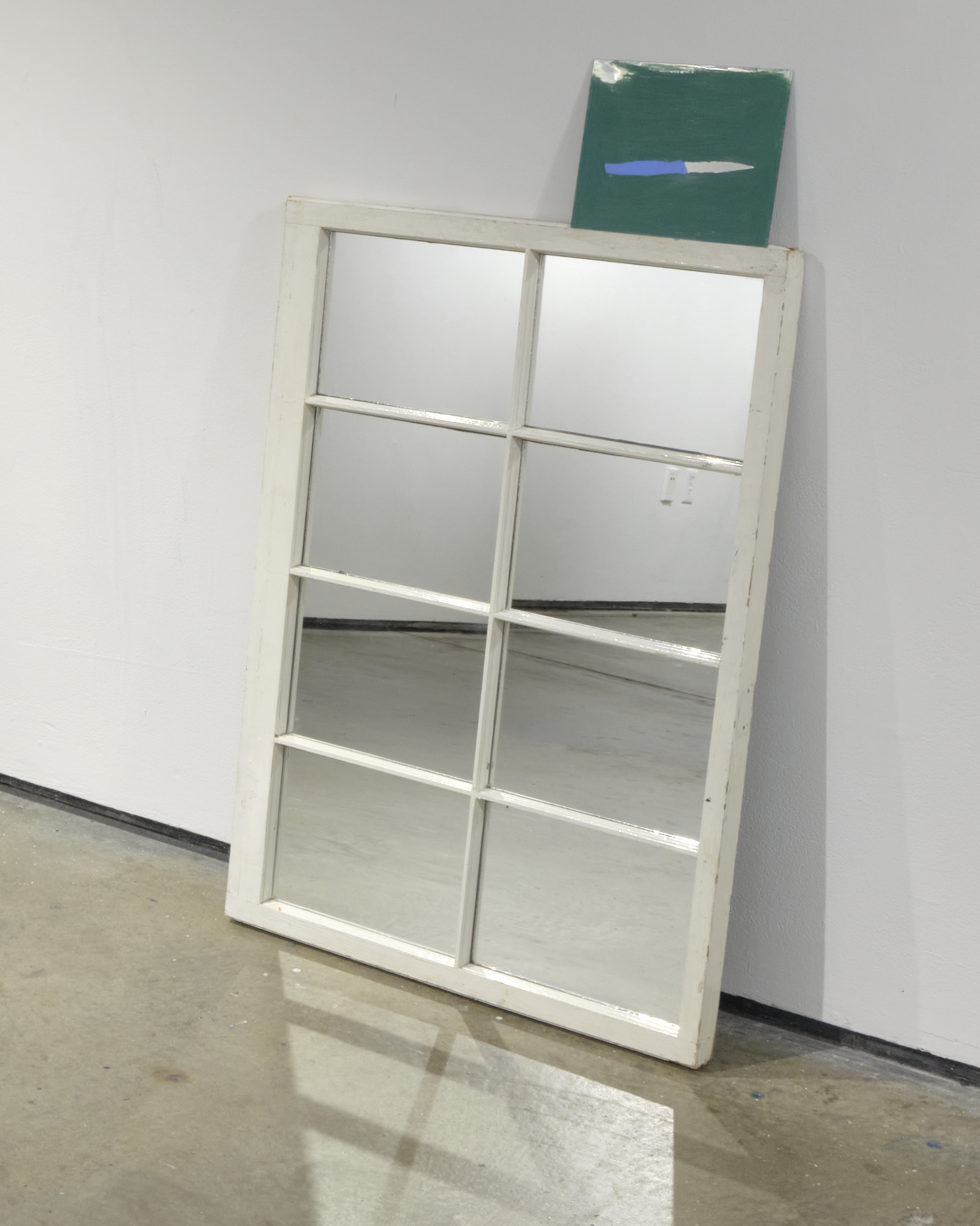 Knife, 2022. Watercolor on mirror on mirror on window, 28 x 47 in.