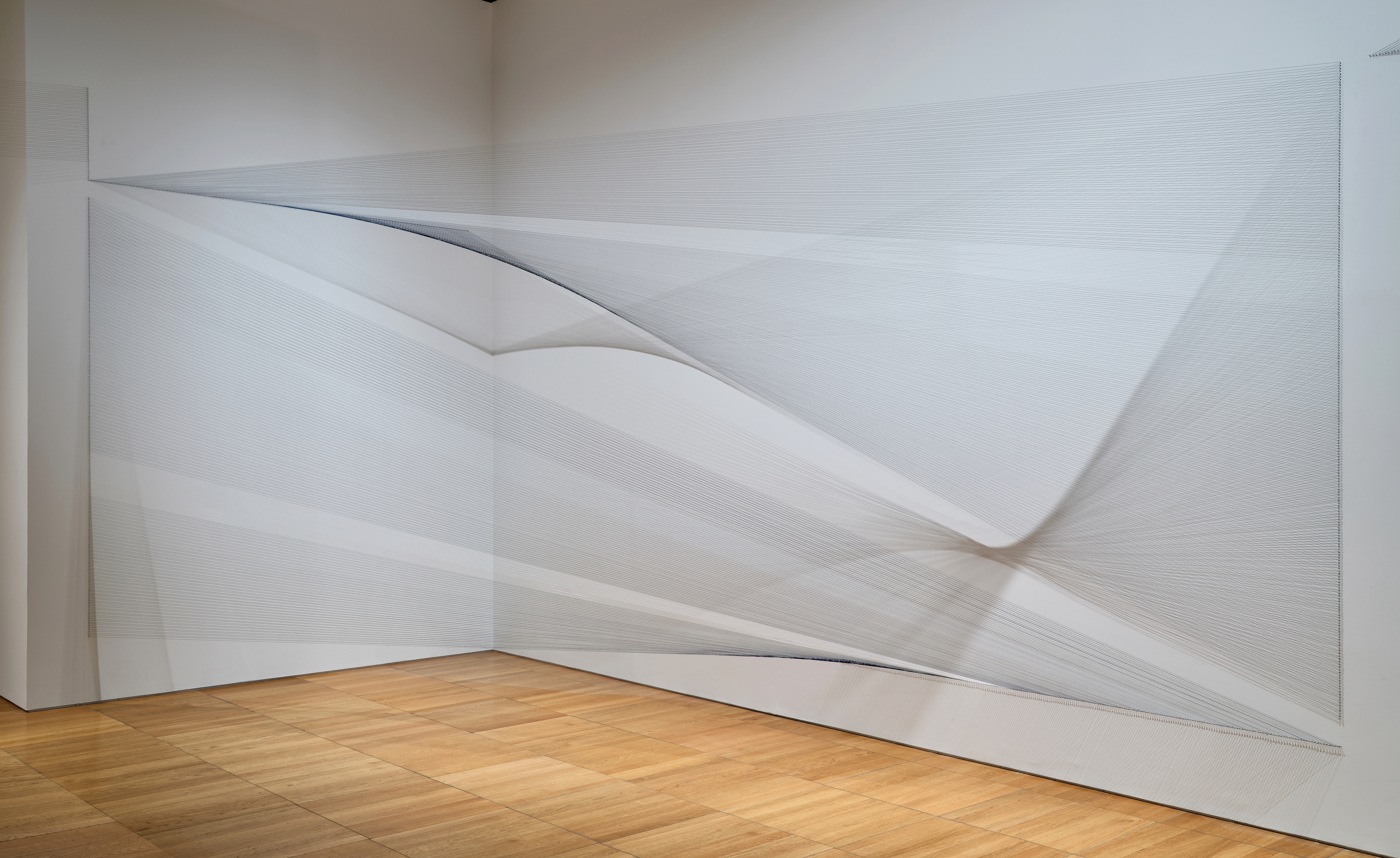 4. Installation view: Haleh Redjaian, The trick is to keep breathing (II), 2024. Thread, nails, walls, floor, dimensions variable. Commissioned by the NYUAD Art Gallery. Photo: John Varghese 5. Installation view: Chafa Ghaddar, Breathing Grounds, 2024. Fresco on wall, dimensions variable. Commissioned by the NYUAD Art Gallery. Photo: John Varghese