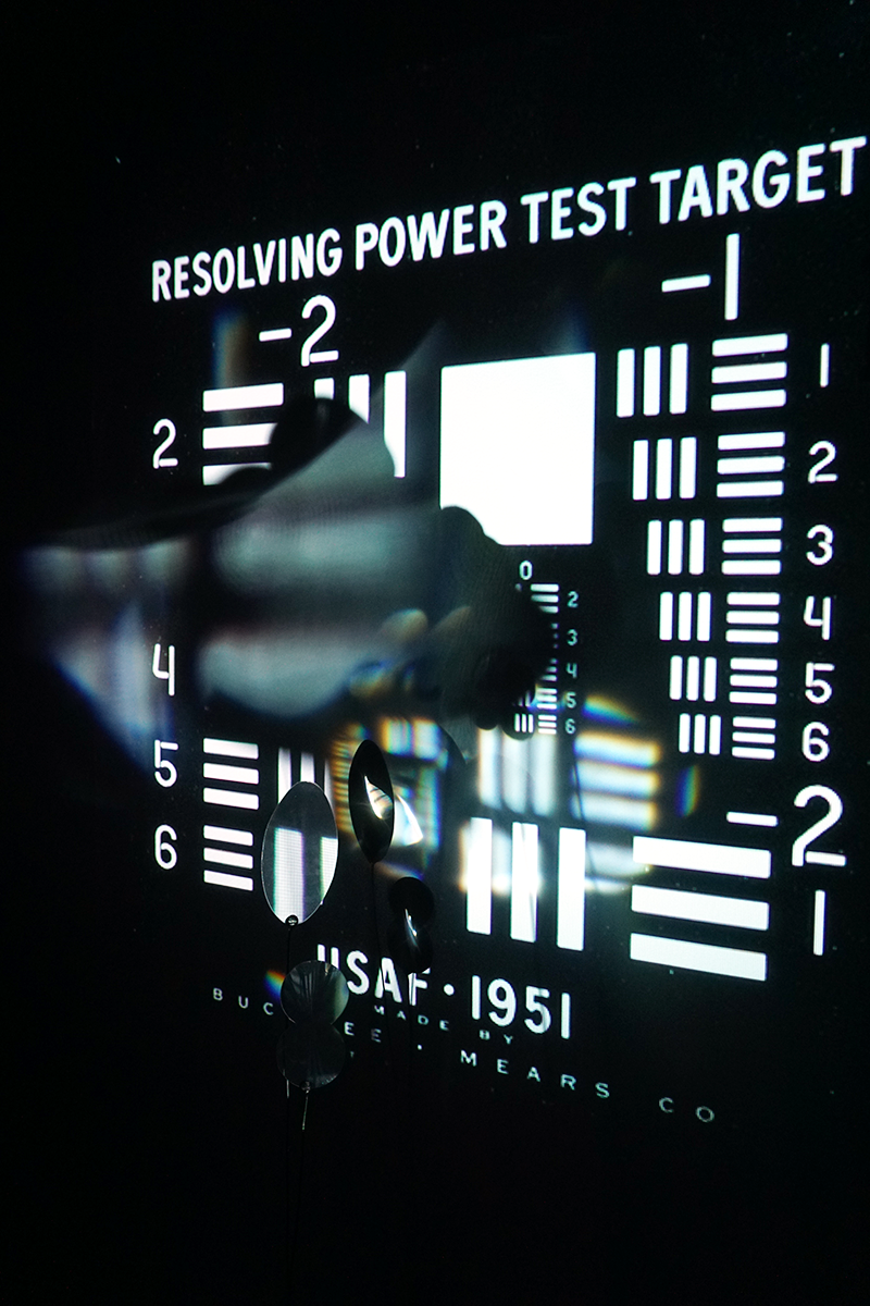 Detail of the projected resolution chart interrupted by the pixels' lenses.