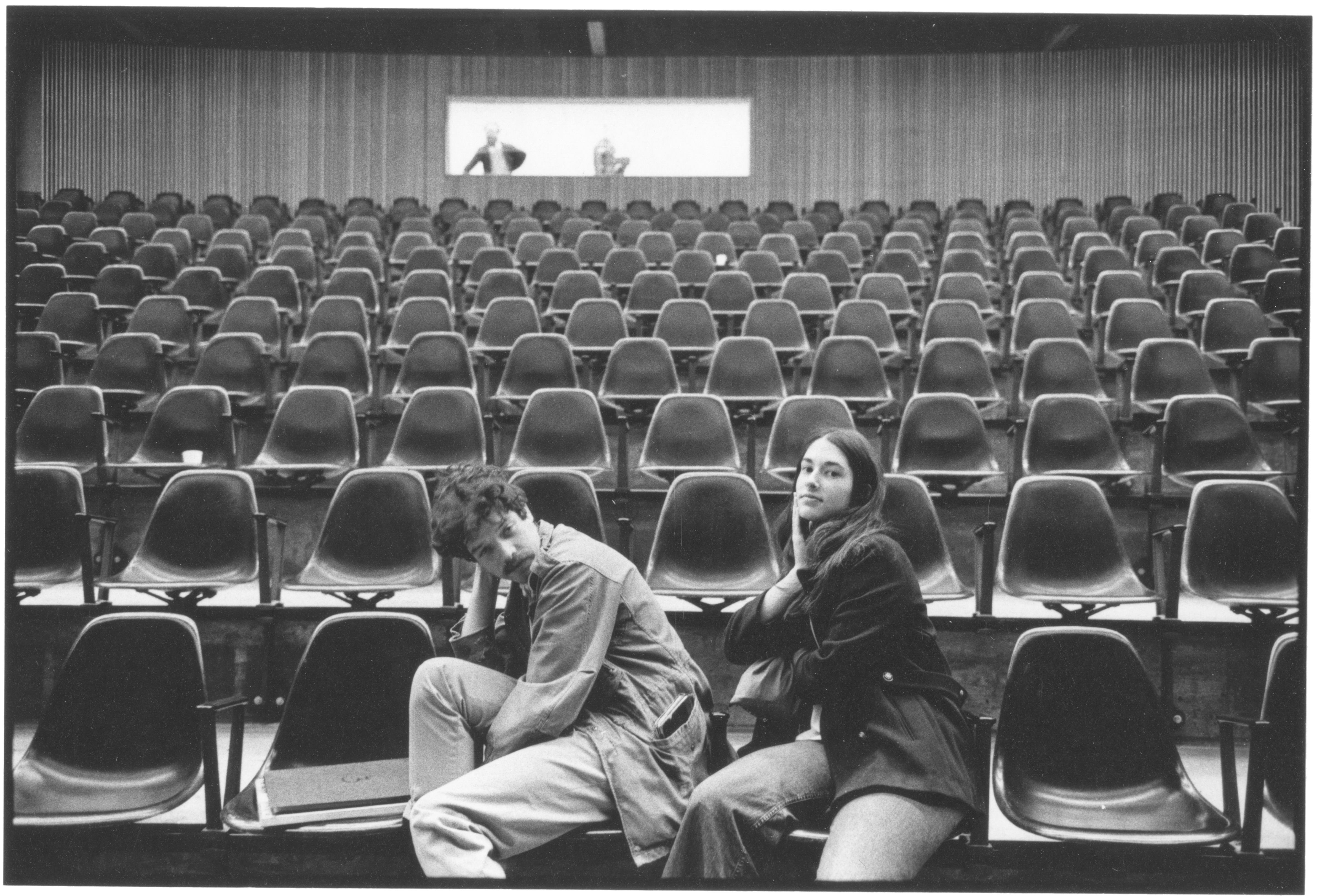 c. 1970s: Two students in the lecture hall.