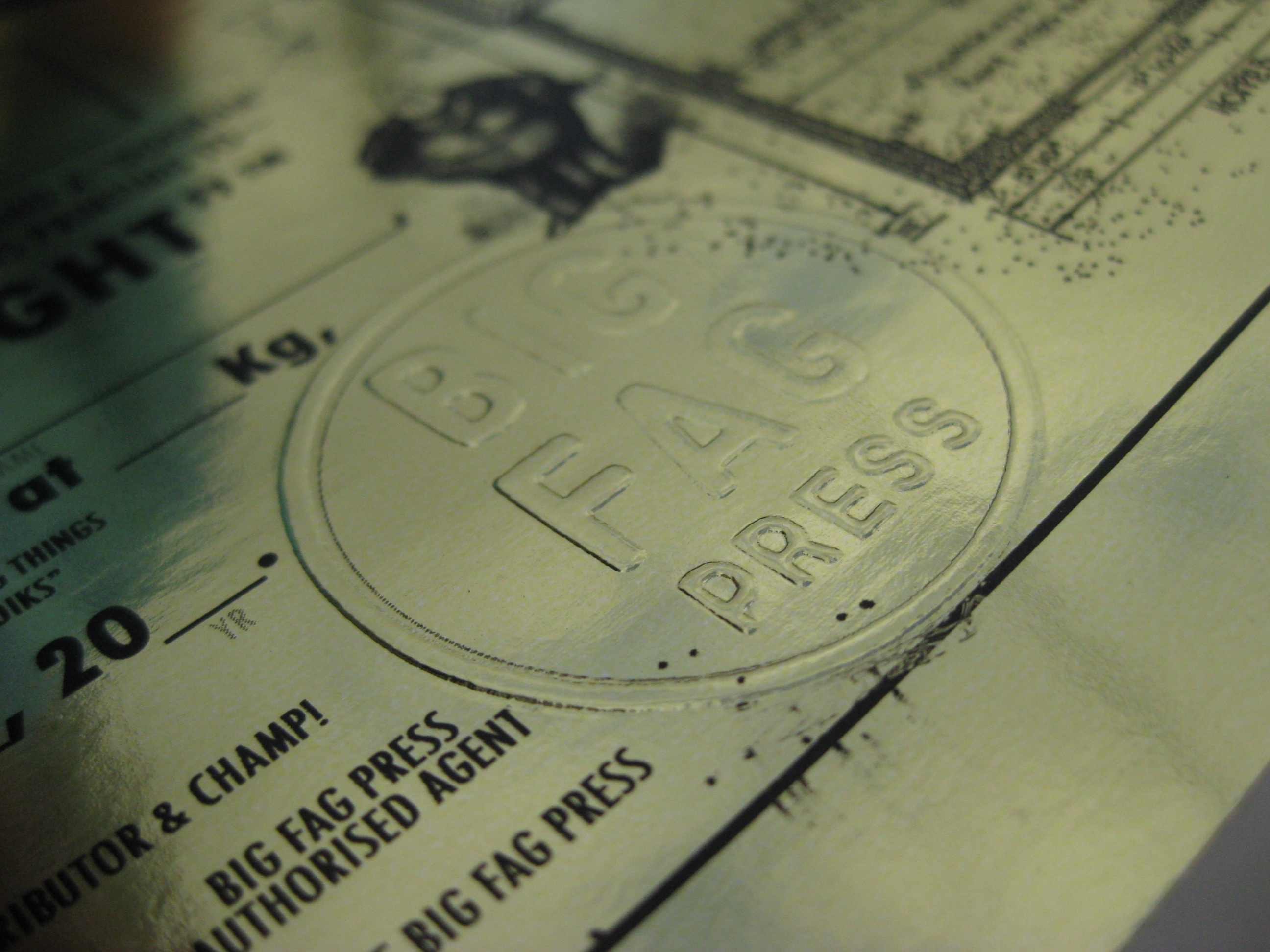 Detail of Big Fag Press logo embossing on gold certificate to accompany Crane Print, design by Mickie Quick, 2009.