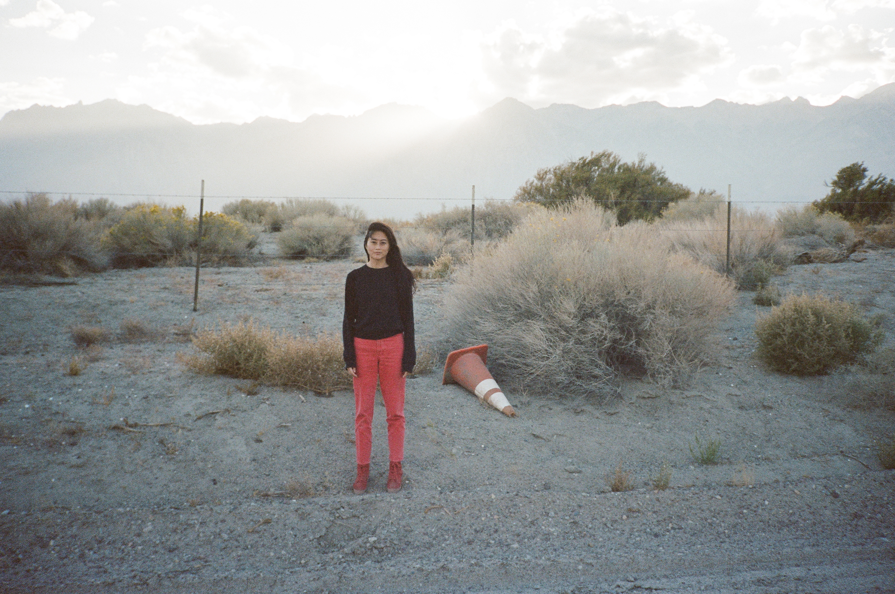 Bz on the side of the freeway with cone near the headwaters of the Los Angeles River in Payahuunadü.  Photo by Red Rotkopf.