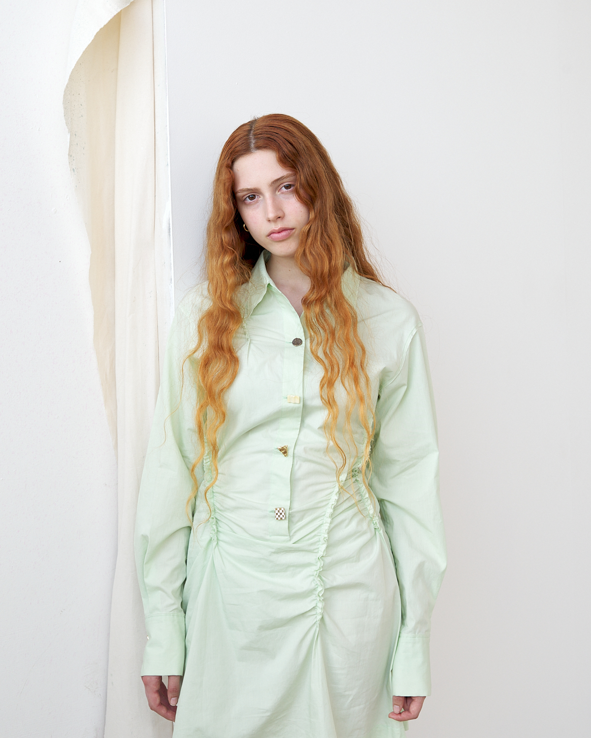 Maria is wearing a dress by Rejina Pyo PF22