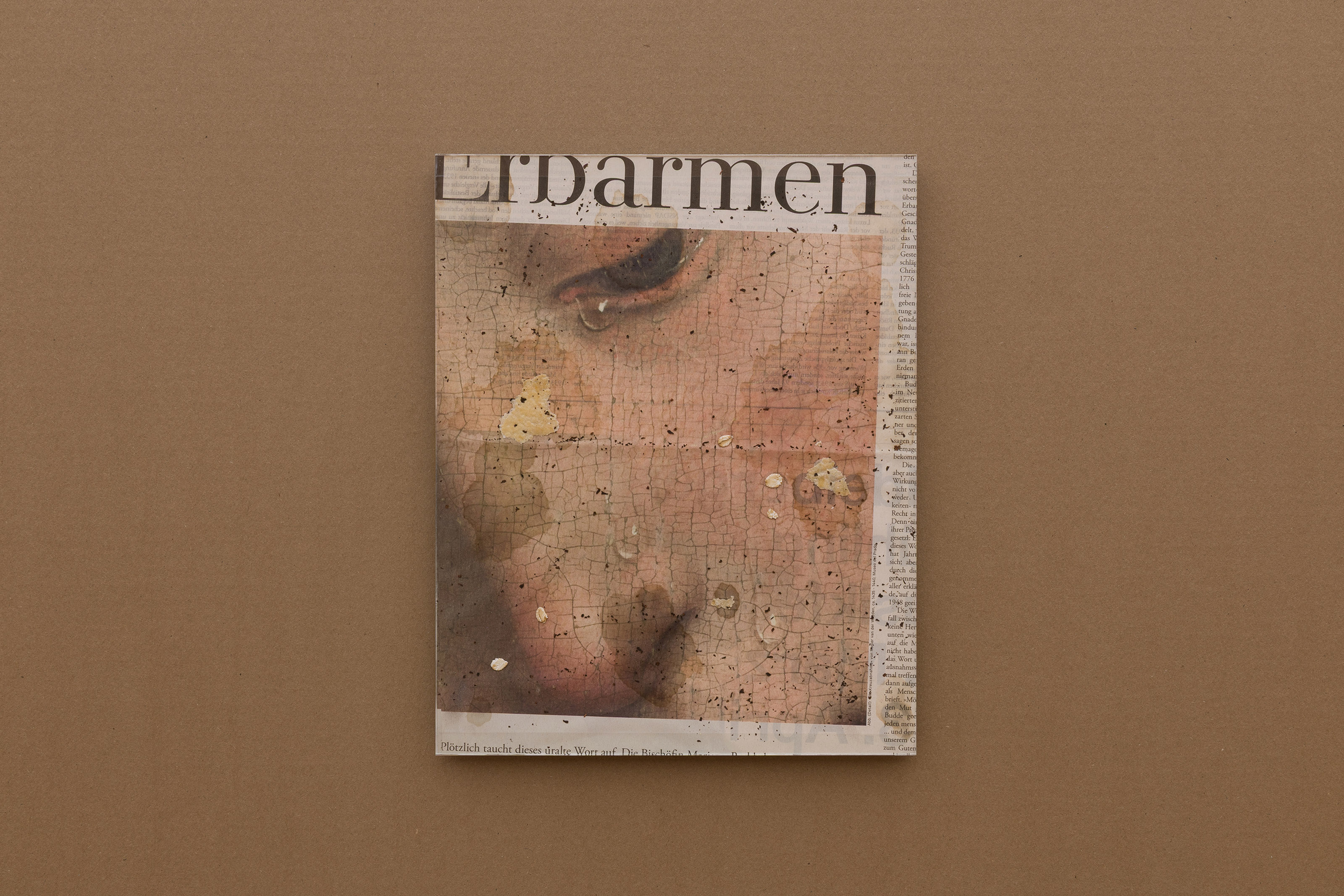 Mercy (Leak), 2025. Black tea leaves, butter, croissant, and oats on newspaper (Die Zeit, January 30, 2025), Artglass AR 99 Water White, acid free board, tape on Dibond, stainless steel. 30 x 24 cm