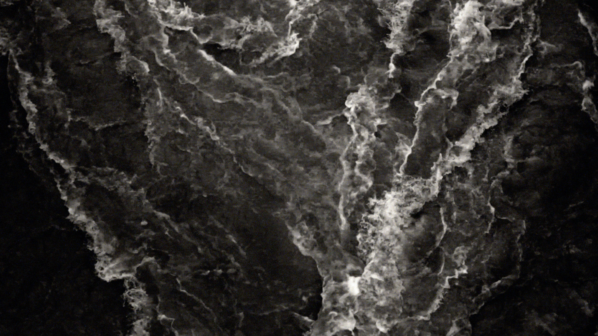 At Any Given Moment, River 3, 2018; video projection:16mm film screened as single-channel video projected at architectural scale, color, sound by Matteo Liberatore; duration 4 minutes. (still frame)