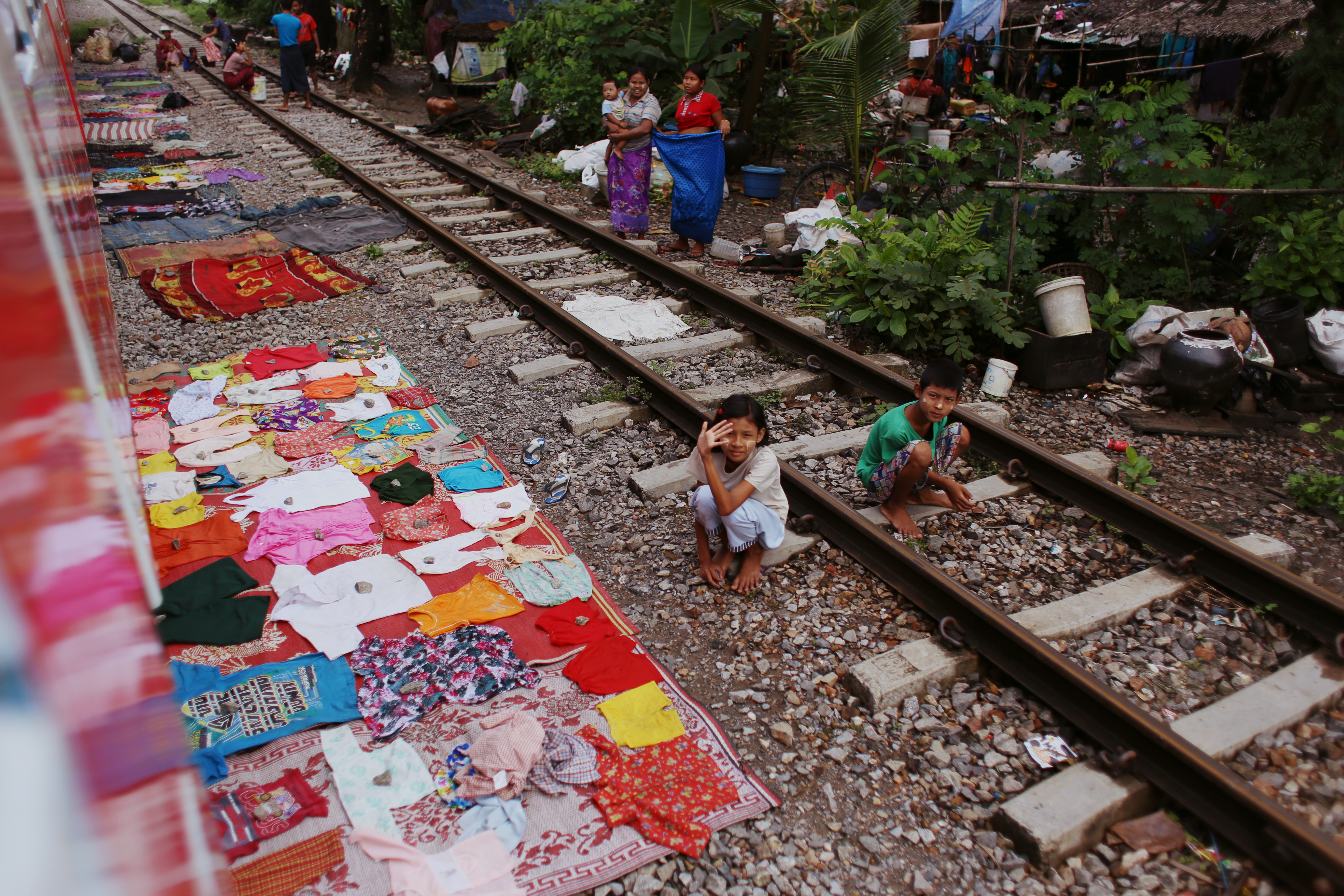 When the sun comes out, drying clothes adorn the tracks. In the downtown areas, the tracks are strewn with rubbish, so it’s a pleasant change to see colourful clothing and waving children.