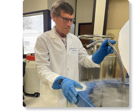 SunnyBay Biotech Chief Scientific Officer Gary Johanning pictured standing next to a liquid nitrogen tank