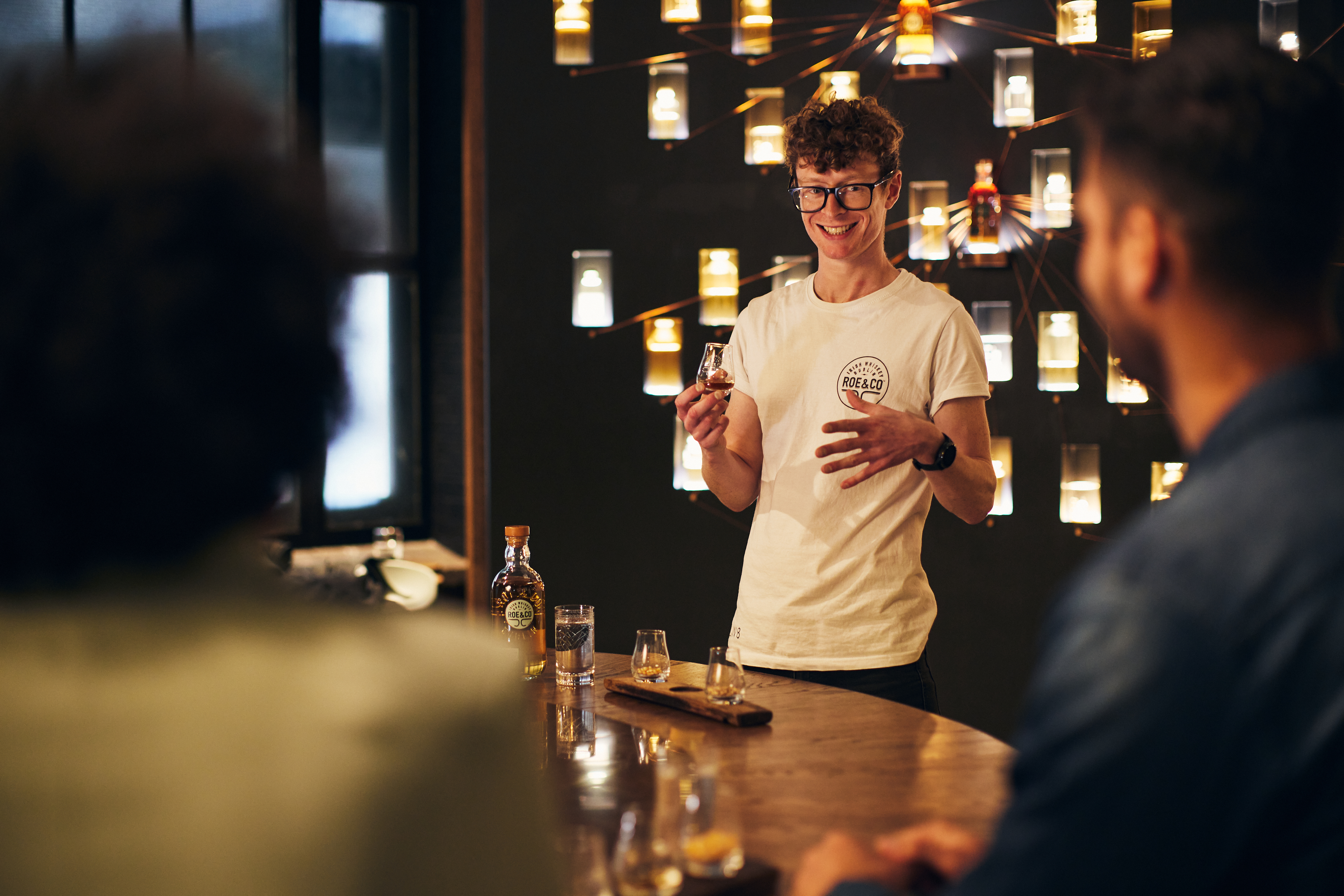 Lifestyle photography of the Roe & Co whiskey tasting and cocktail making experience in Dublin, Ireland. Captured by renowned lifestyle and advertising photographer Alex Sheridan, this photography showcases the sophistication and elegance of this exclusive experience. From the beautiful surroundings to the delicious cocktails, this photoshoot is a visual delight.