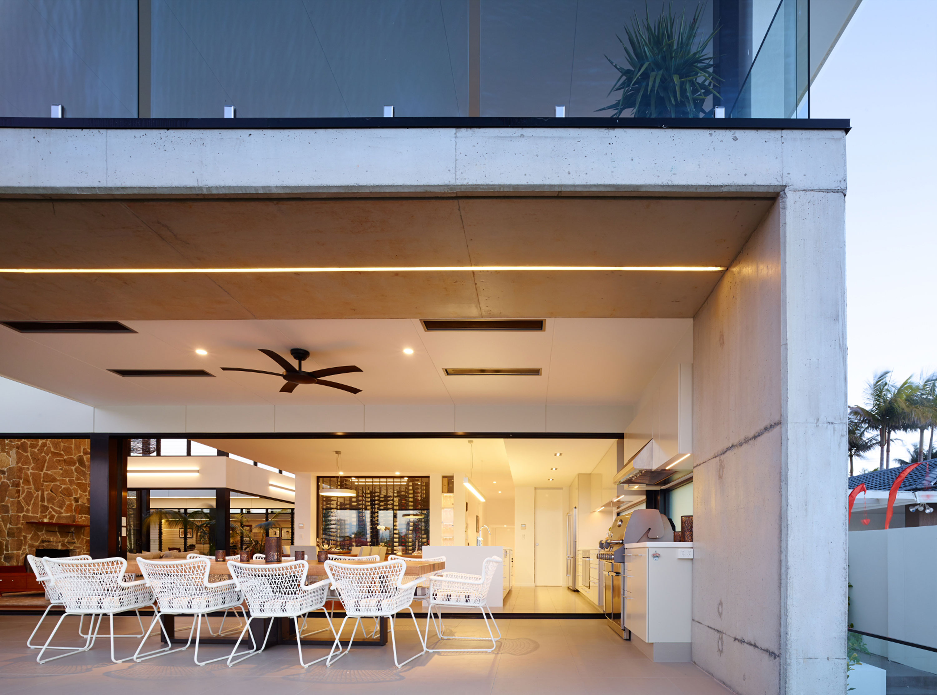 Elegant home with a dining area and a ceiling fan, blending modern design and functionality.