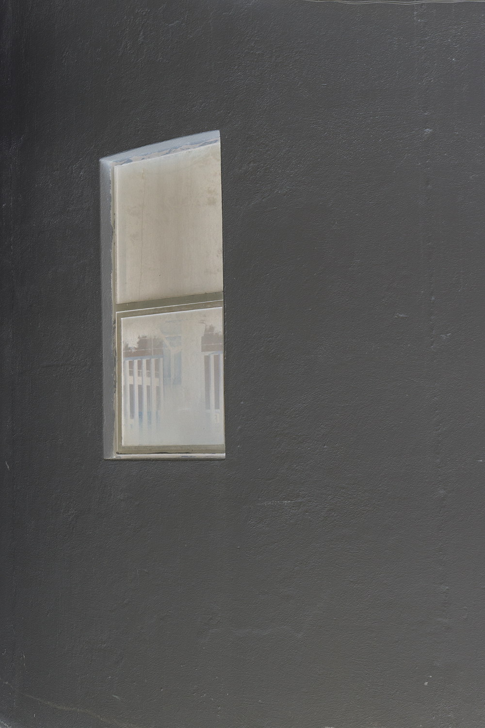 carina martins, a passing view - window in a grey wall