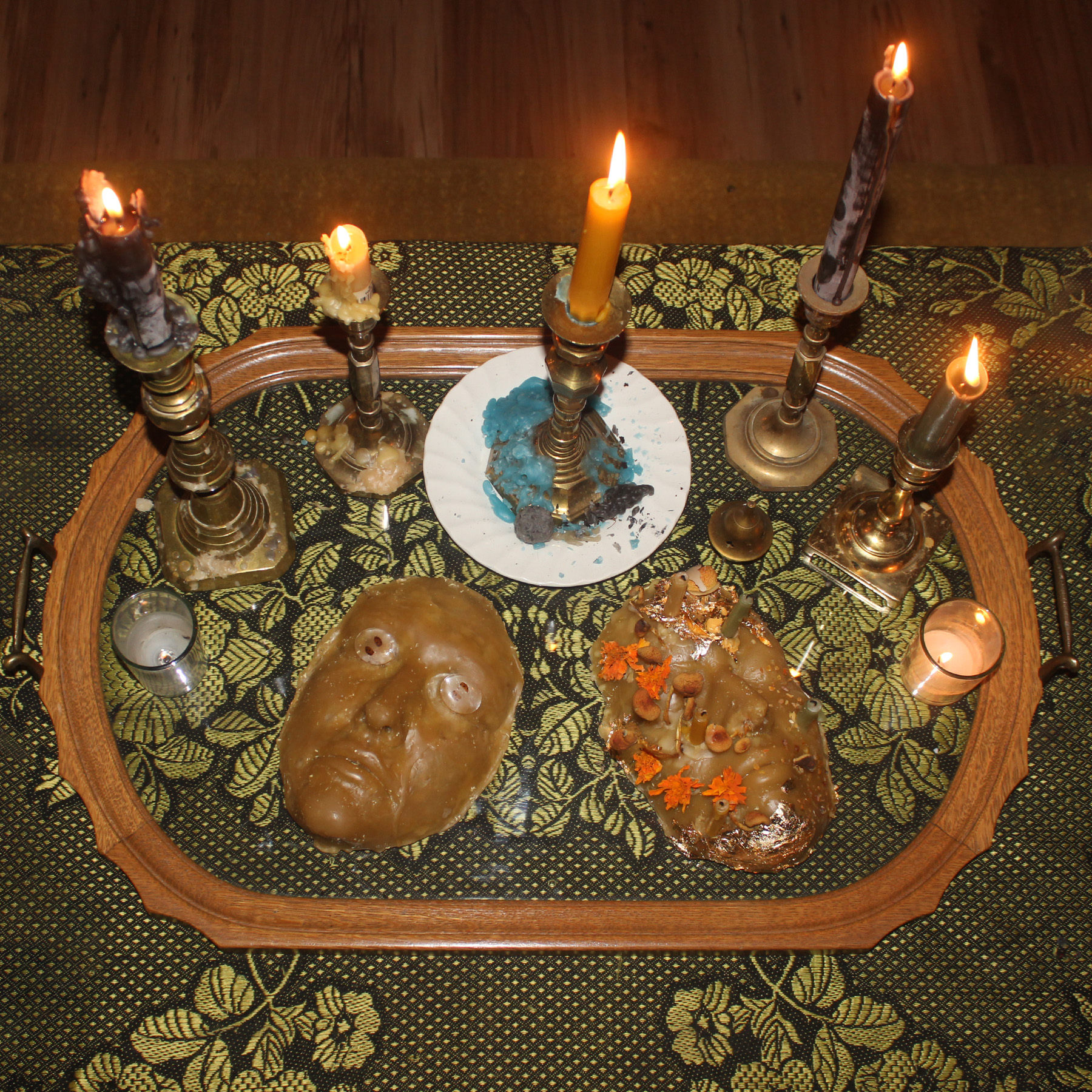 Beeswax Death Mask & Lady Bug Wing Coins, Winona Julian, 2023 (Left) / Beeswax Death Mask Jess Richter, 2023 (Right)