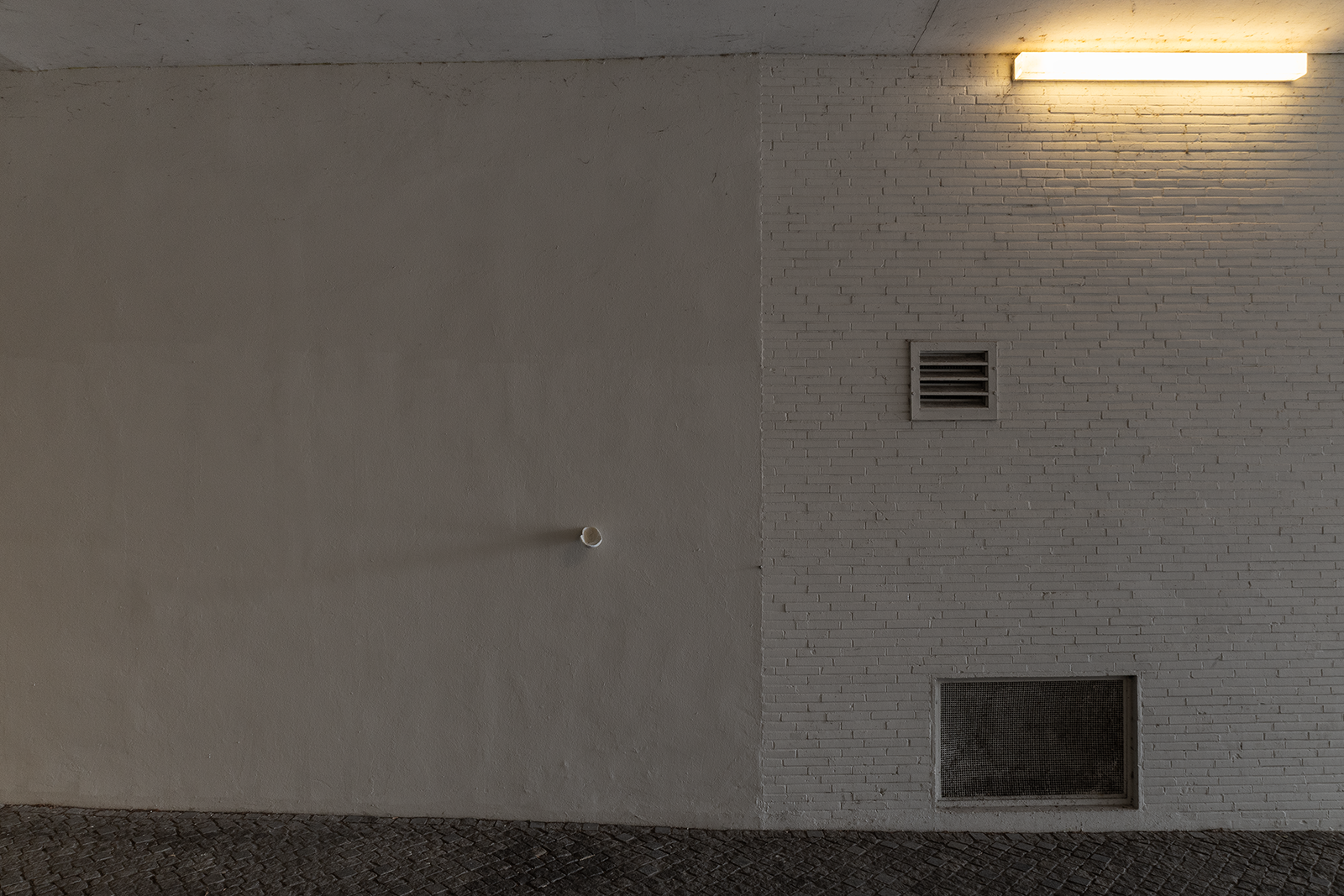 Bystanders (Public Ashtray), 2026. Acrylic One resin, air-dry porcelain, cigarettes and rubbish added by the passerby (outdoor installation). Various dimensions.