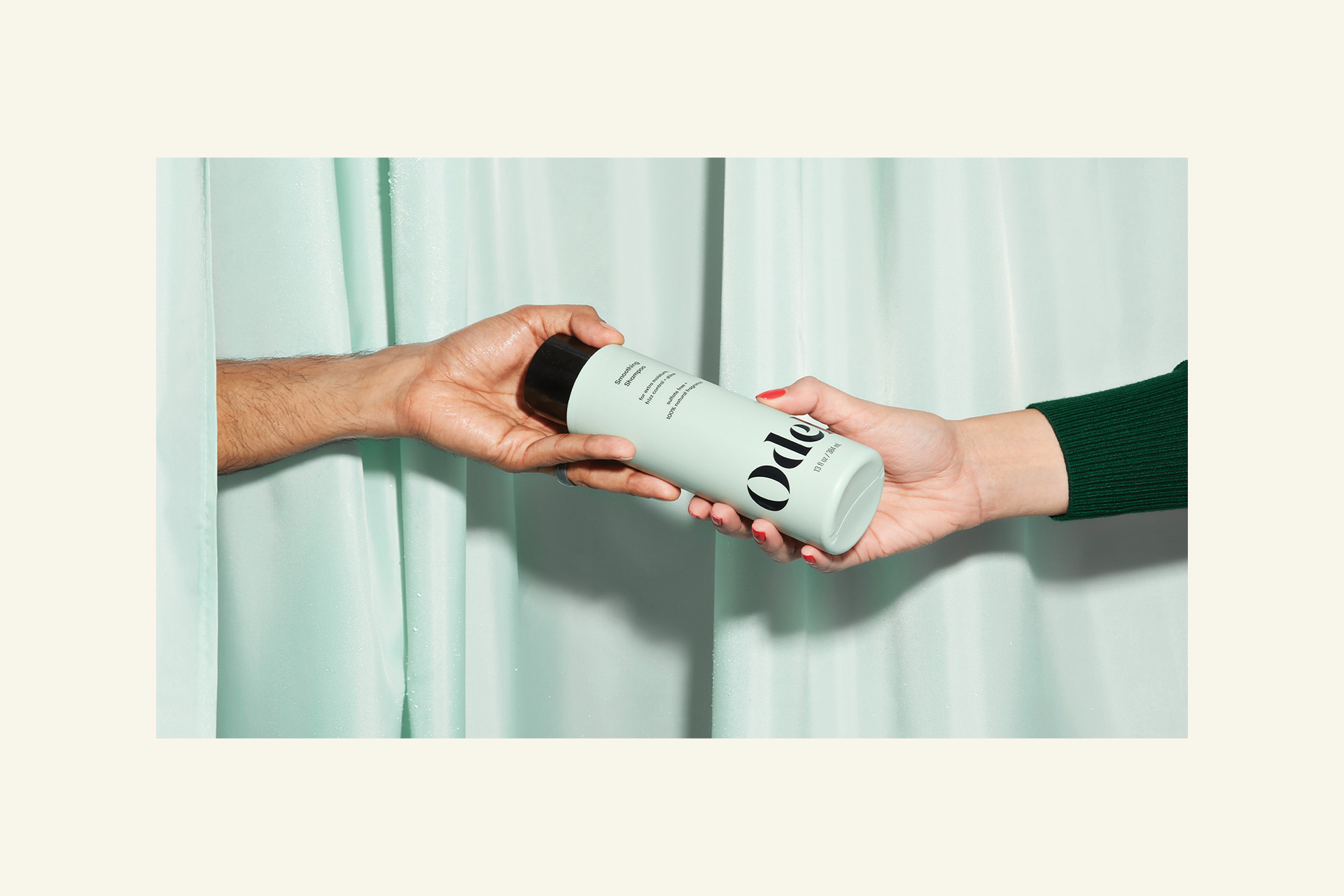 Hands sharing a bottle of Odele shampoo packaging design by Buddy-Buddy