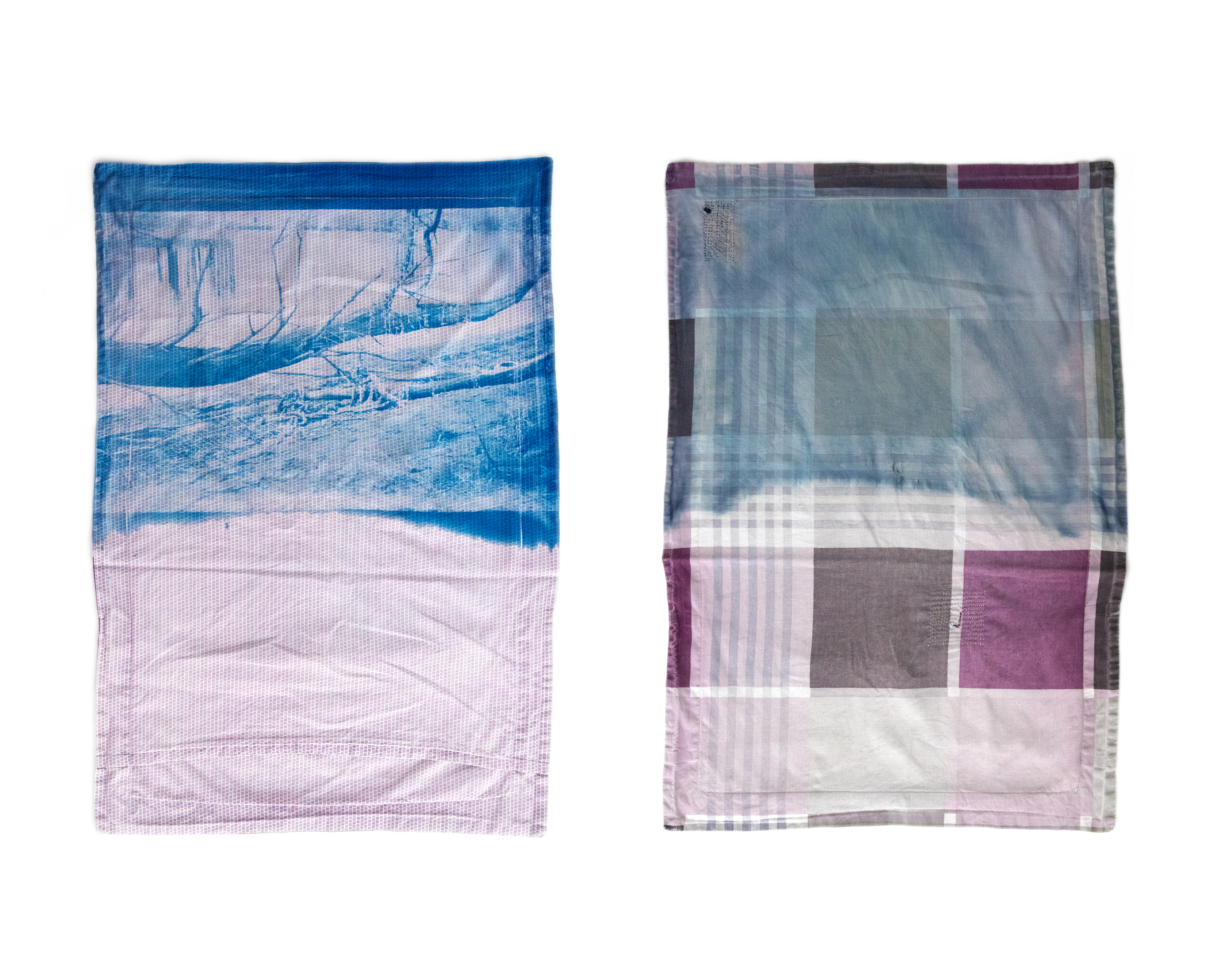 Cyanotype on hand darned old pillow case close up.