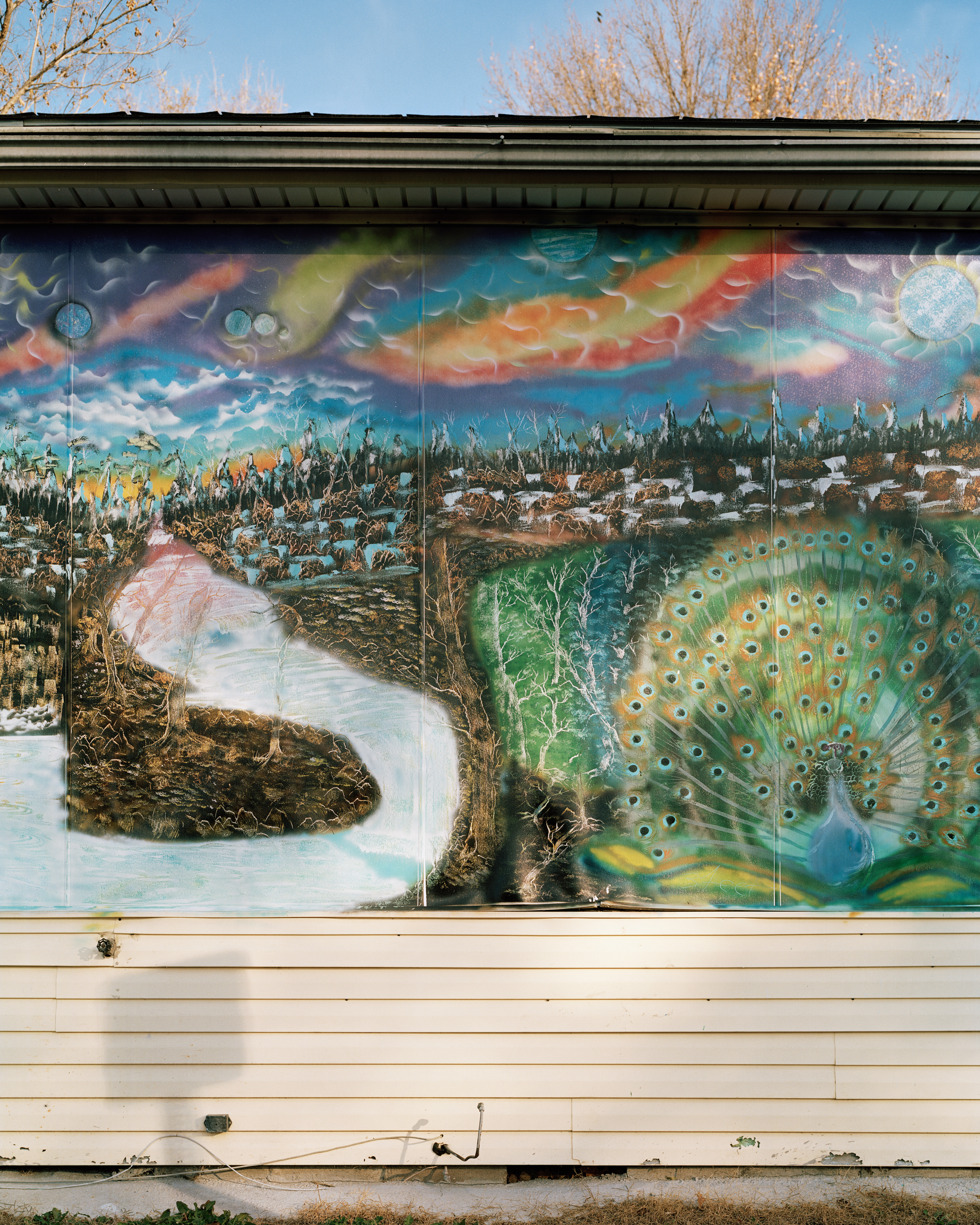 A mural of Northern Iraq and the Peacock Angel, Tawsi Melek, the most important deity in the Yazidi religion.