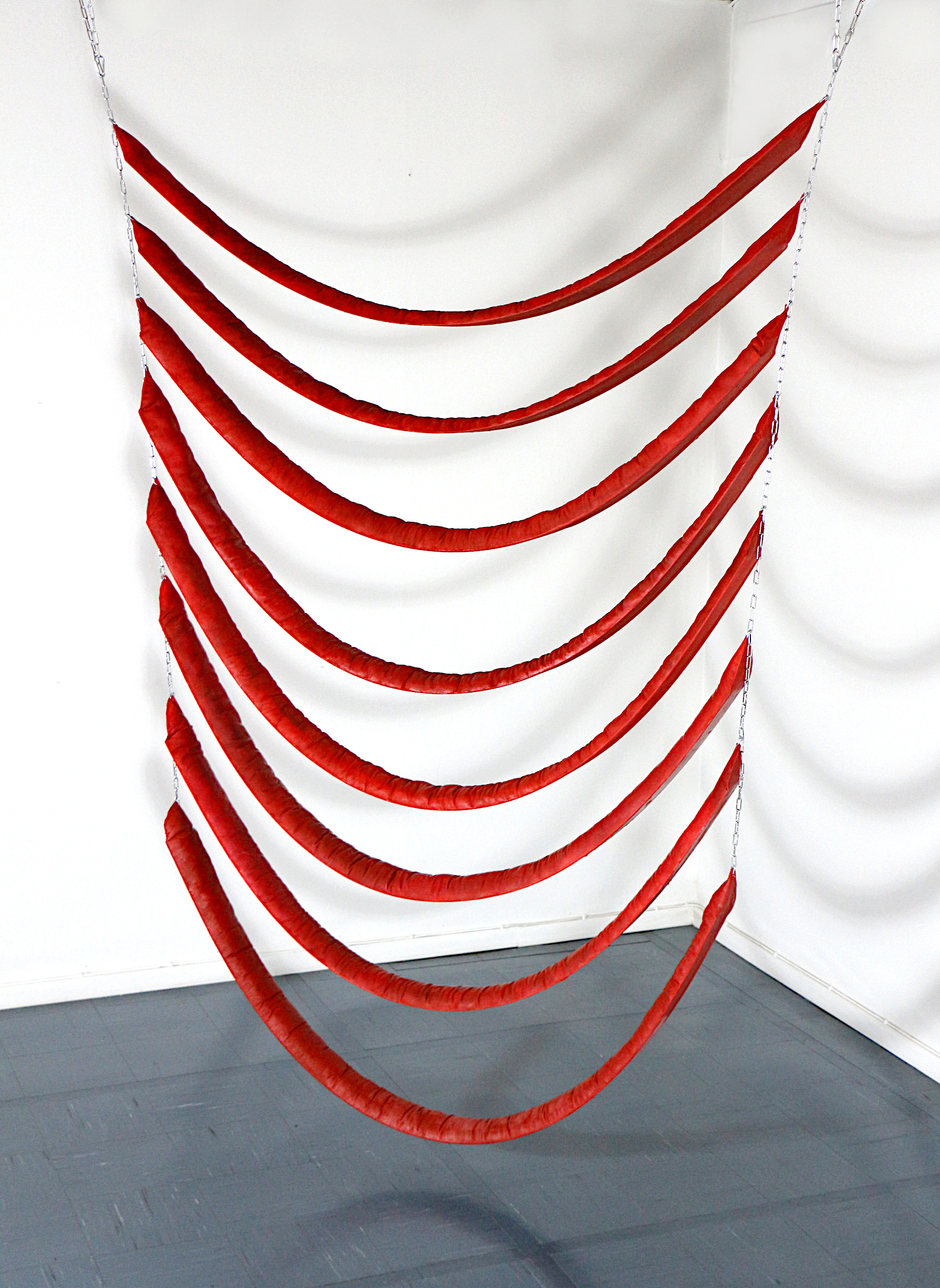 Red hanging installation by multidisciplinary artist Lana Haga