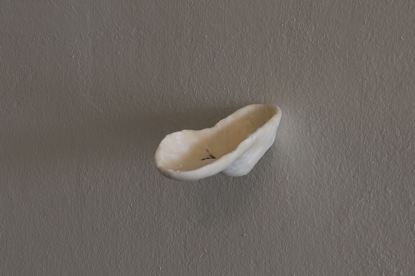 Bystanders (Public Ashtray), 2026. Acrylic One resin, air-dry porcelain, cigarettes and rubbish added by the passerby (outdoor installation).  Various dimensions.