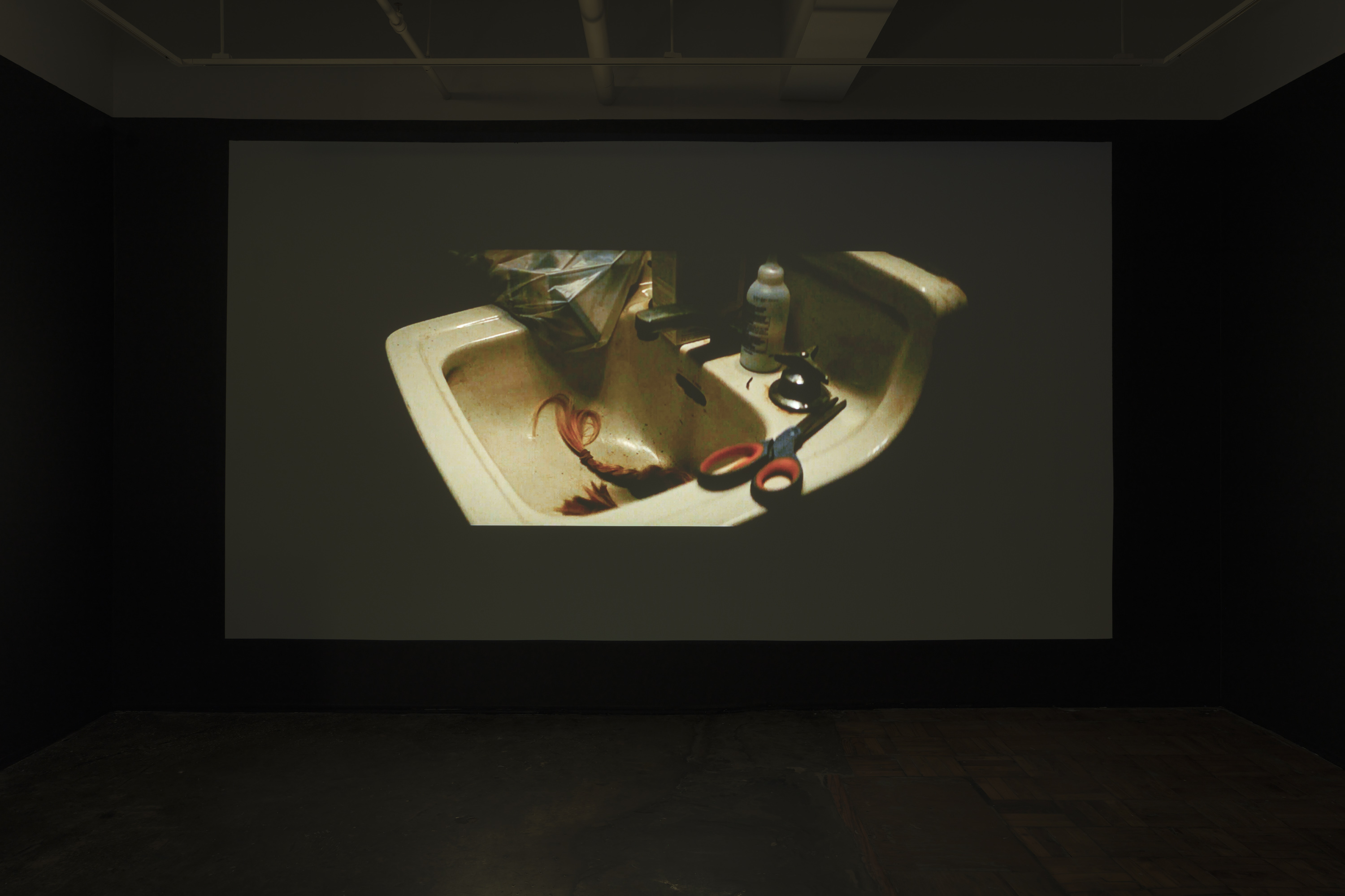 9/10 — THE HAIRCUTThe Haircut reconstructs selected scenes from movies where female characters cut their hair or have their haircut unwillingly. Reasons range from pretending to be a man to compete in a horse race (National Velvet, 1944), embodying a feline aesthetic as a vigilant antiheroine (Catwoman, 2004), aligning with male military standards (GI Jane, 1997), to retaliation by classmates for being involved in a severe cyber-bullying case (We Not Naughty, 2012).The provided file hosts a ten-minute excerpt from the project. The full-scale work contains close to 600 scenes with an approximate duration of 18 hours, to be presented as a single-channel video installation.Video, 18 hours, 2018-2020. Installation images at AIR gallery by Sebastian Bach