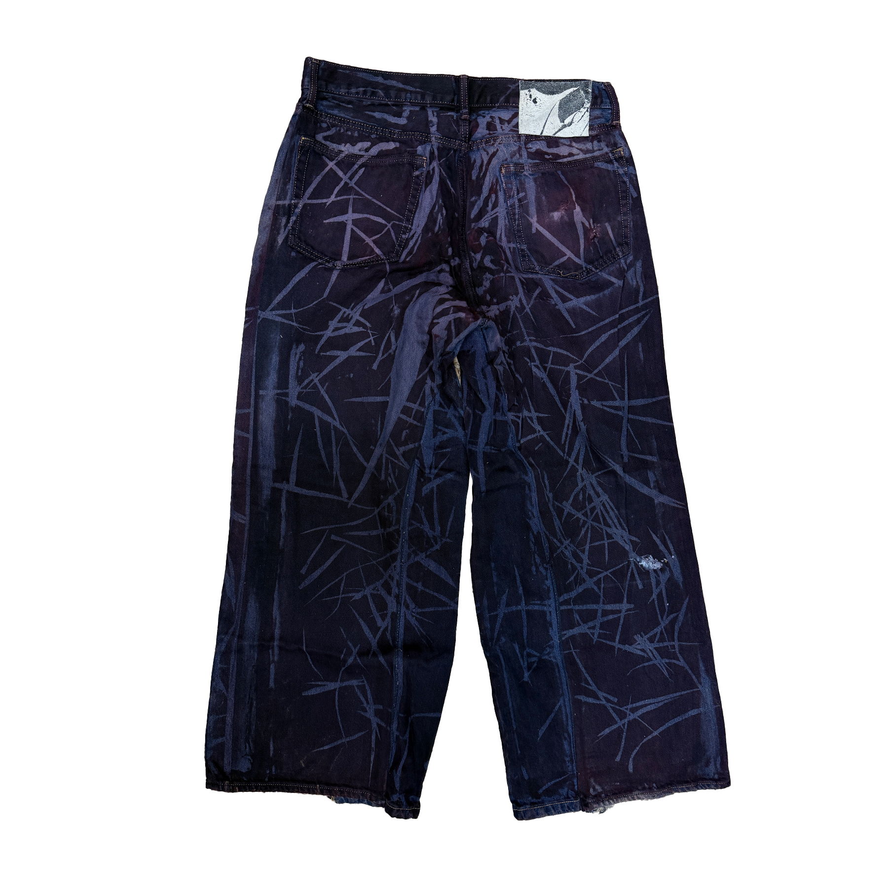 reclaimed vintage surplus denim screen printed with textile dye & grass resist. tailored for straight/wide fit. fitted with custom keychain, scrap chain, and leather patches