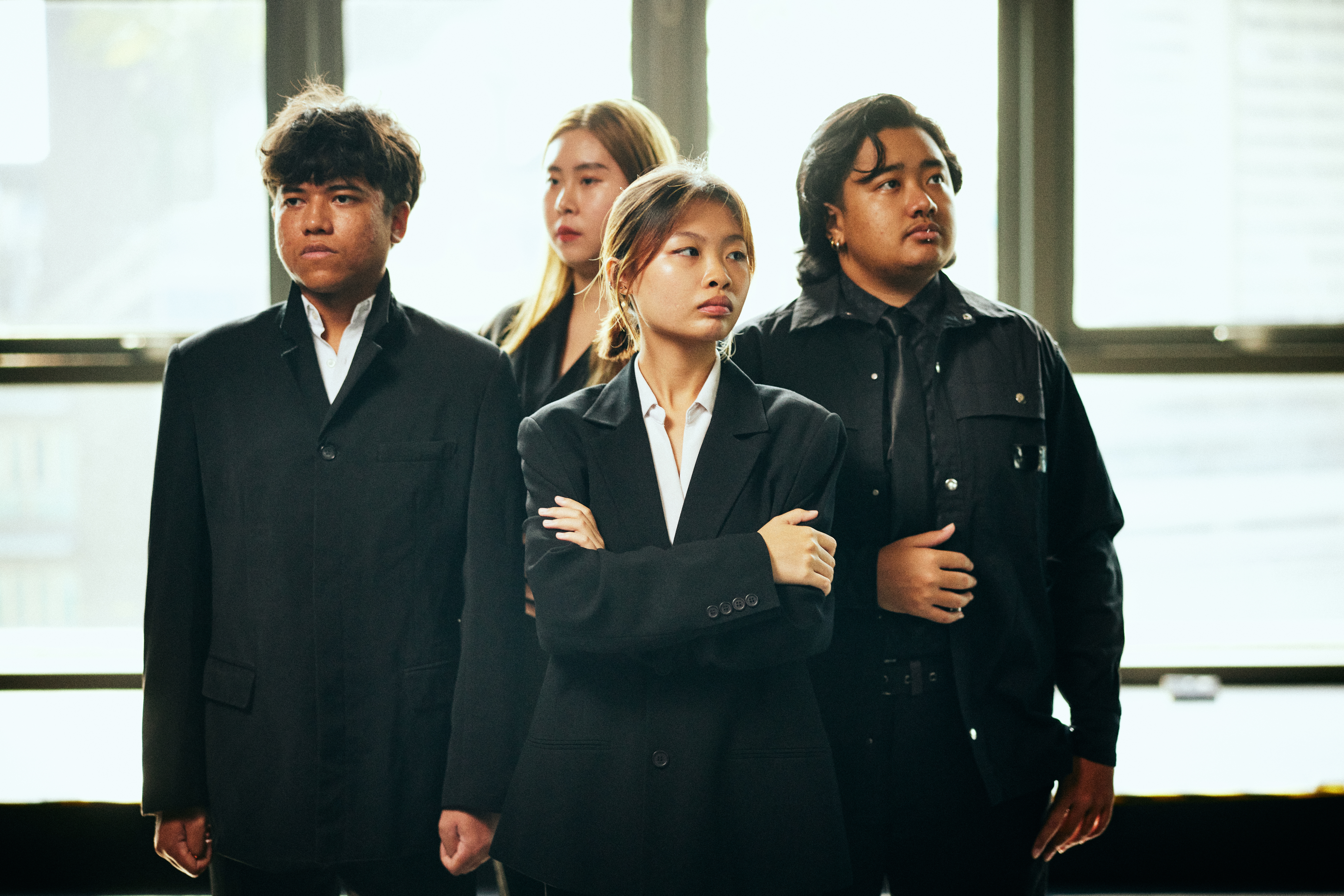 Image 1 of 7: A group of Asian youths