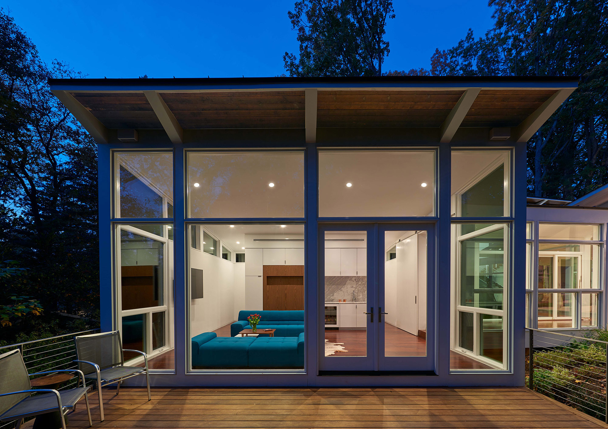 Exterior of the living/guest pavilion from the deck at dusk