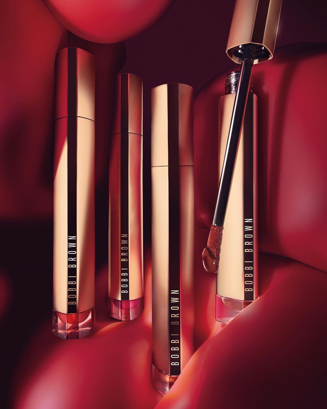 KMA stylist Rachel Haas designs set for photo of many shades of concealer sticks on black background for Hourglass